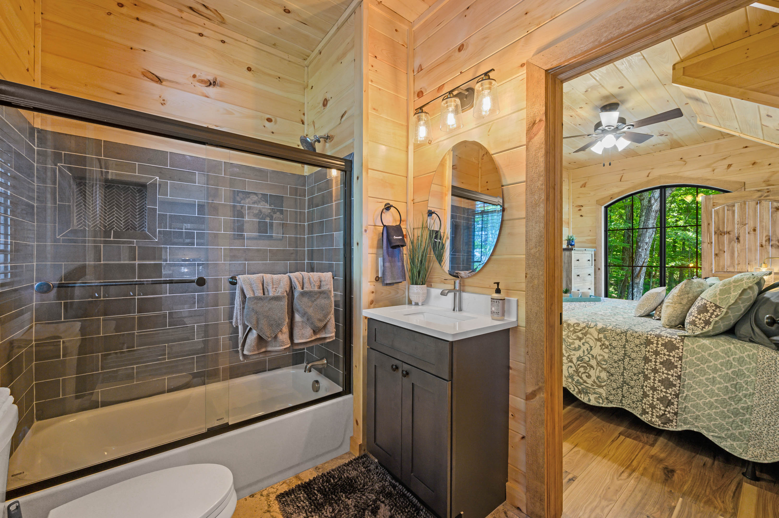 Juniper Cottage Full bathroom with shower and tub by master bedroom on main floor