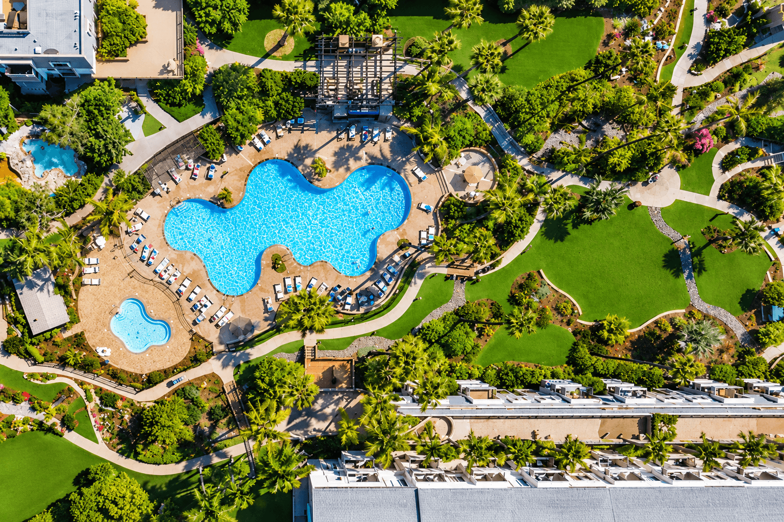 Main pool, two hot tubs, and a seven-hole putting green