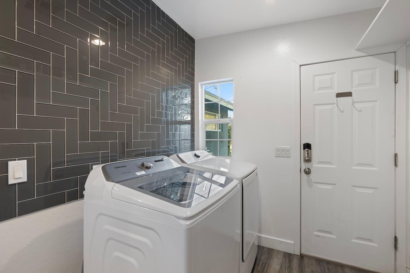 Convenient laundry area featuring a washer and dryer, designed for efficient and organized laundry care.