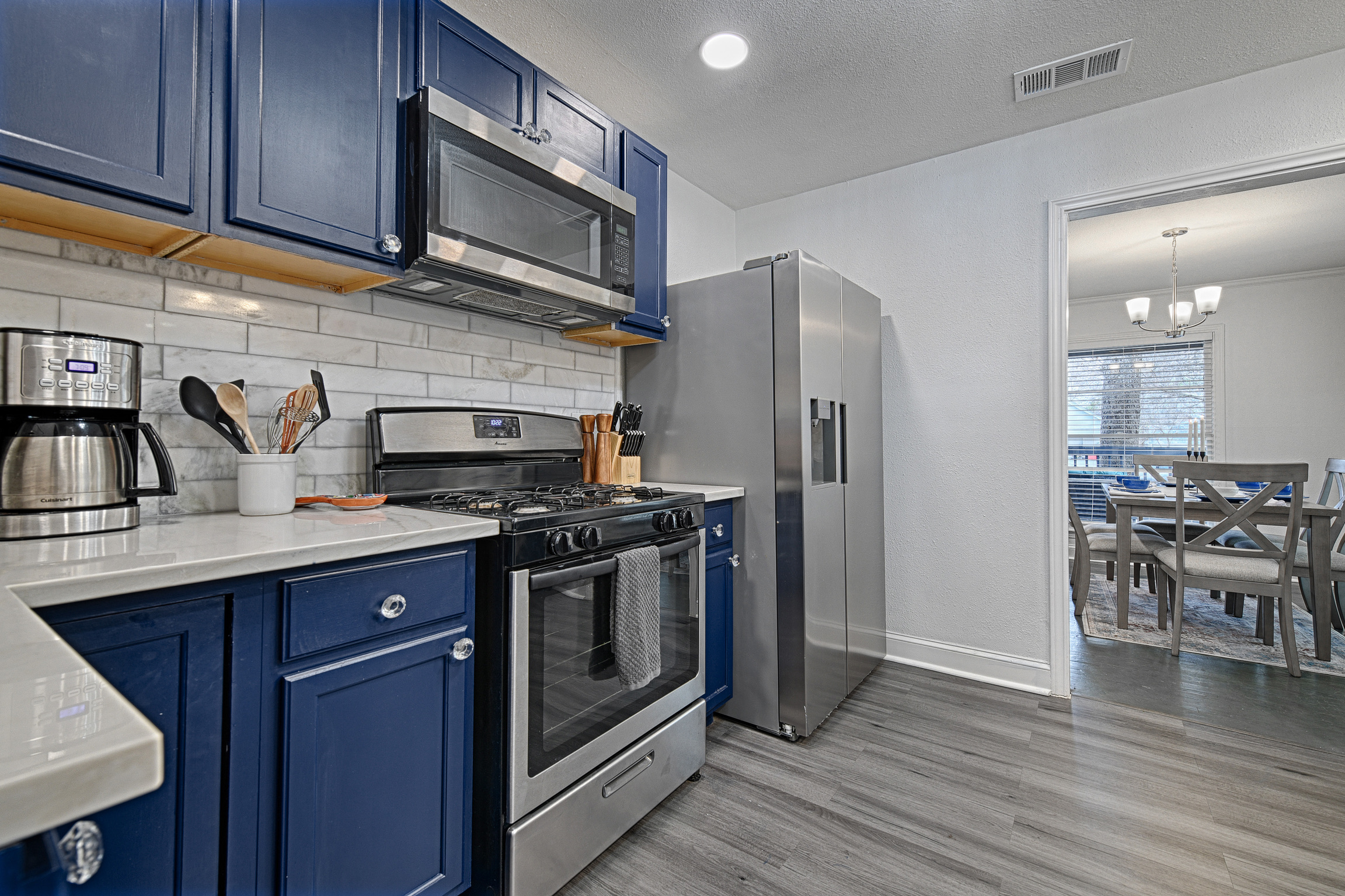Kitchen with full size refrigerator, stove, and oven!