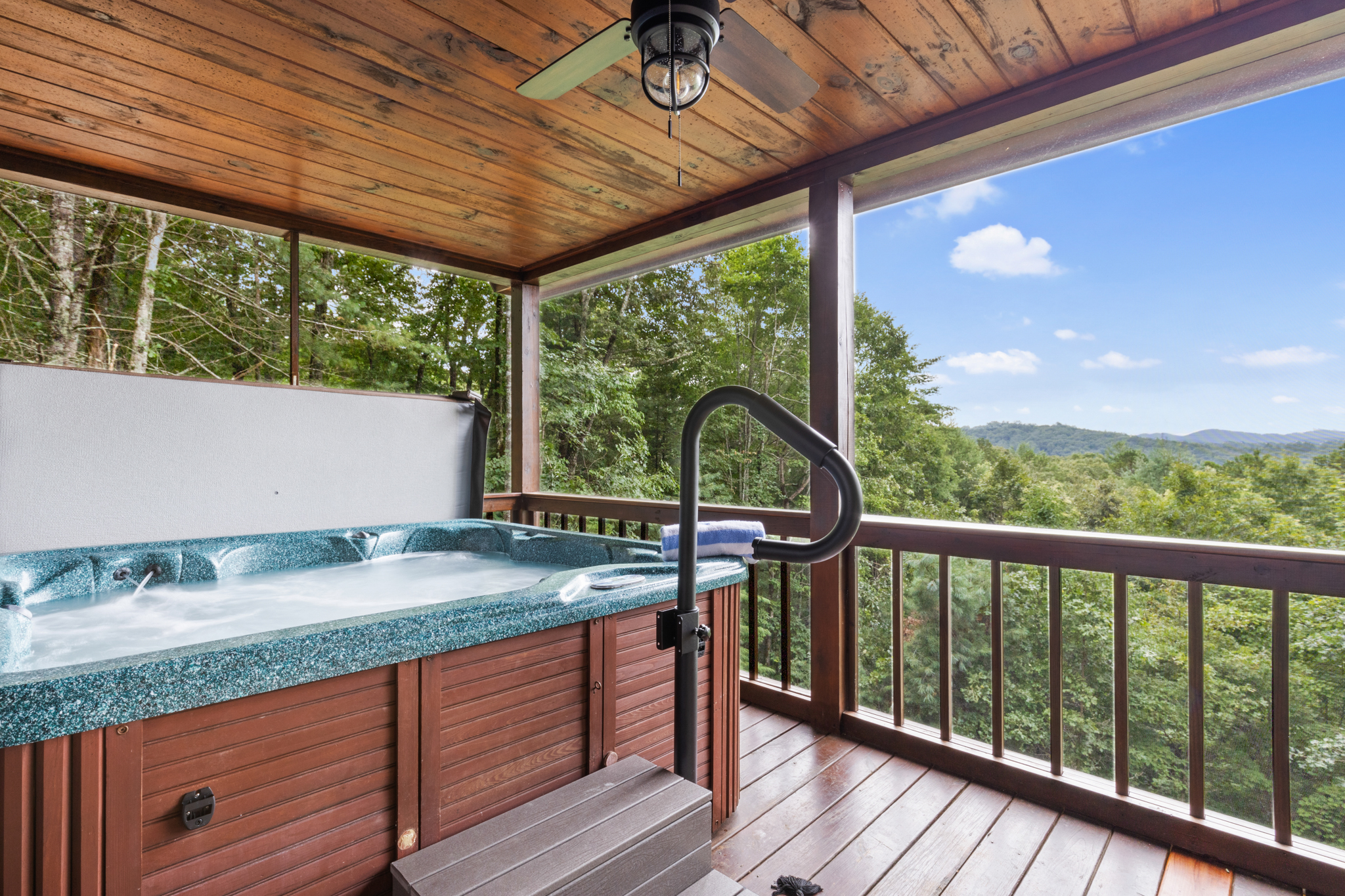 Enjoy the year-round mountain views while relaxing in the hot tub located on the main-level screened in deck.