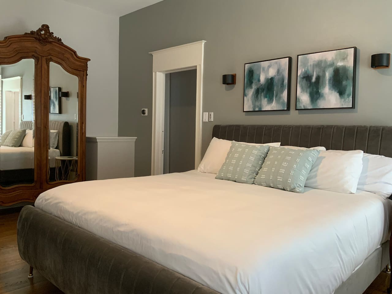 Master bedroom with comfortable king bed and a beautiful Louis the XV Armoire for your use.