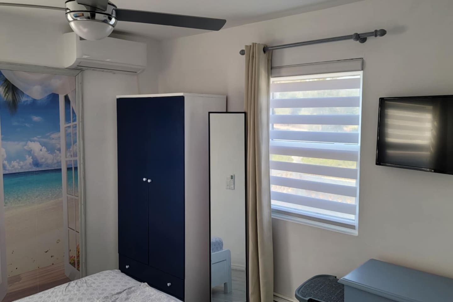 Remote controlled air conditioning, wardrobe with hangers, Flat screen app TV, room darkening curtains.