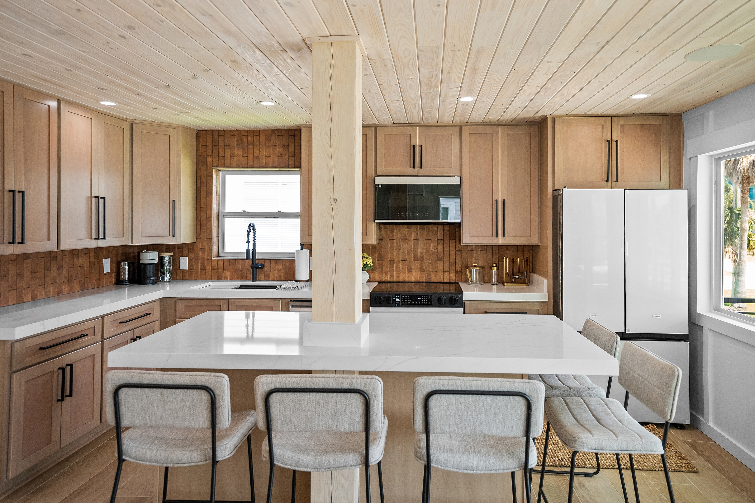 Fully equipped kitchen with generous counter space and island seating.