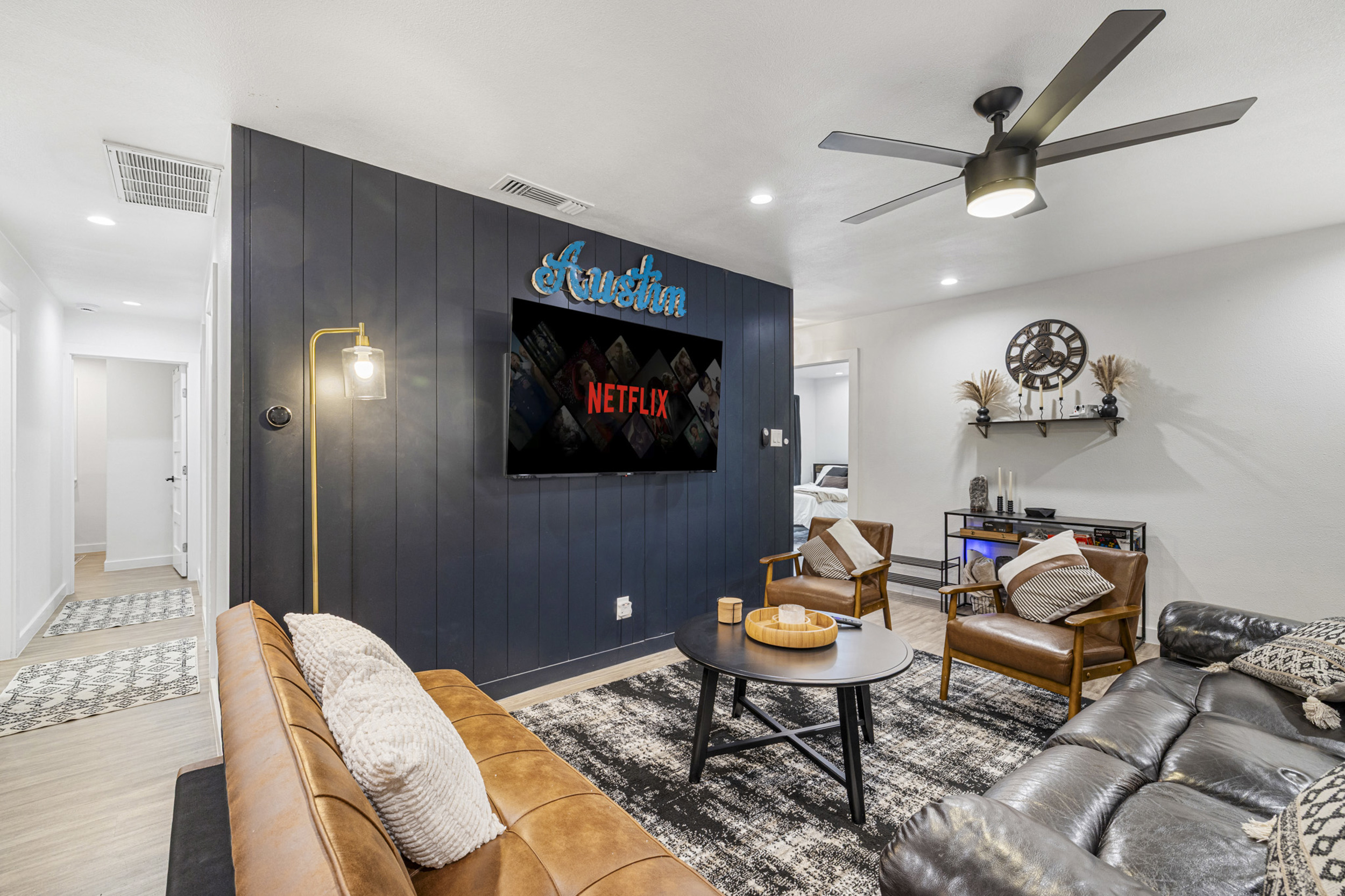 Stylish retreat with sleek furniture and a big screen for movie nights!