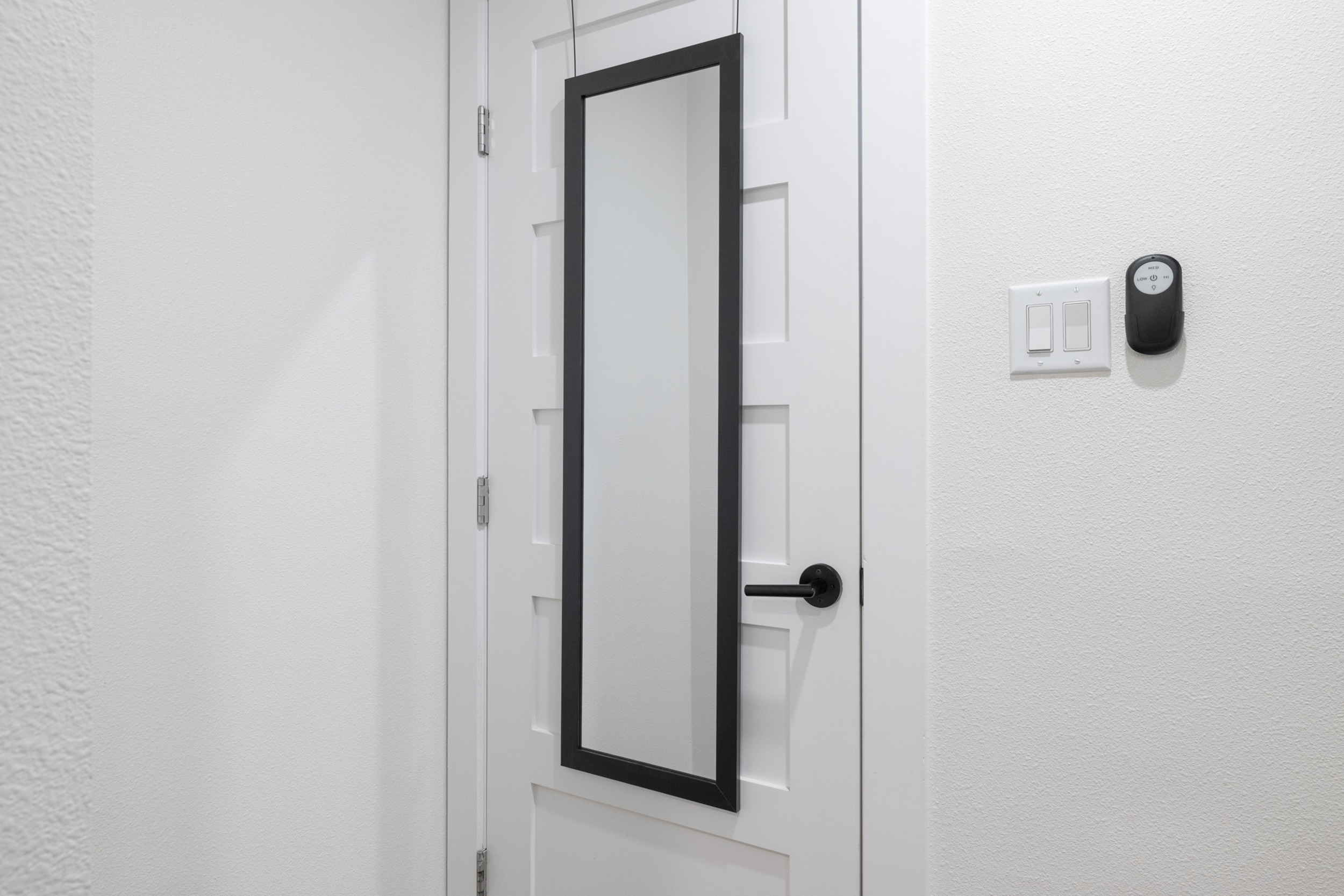 Step into style with this sleek door featuring a chic mirror and modern finishes!
