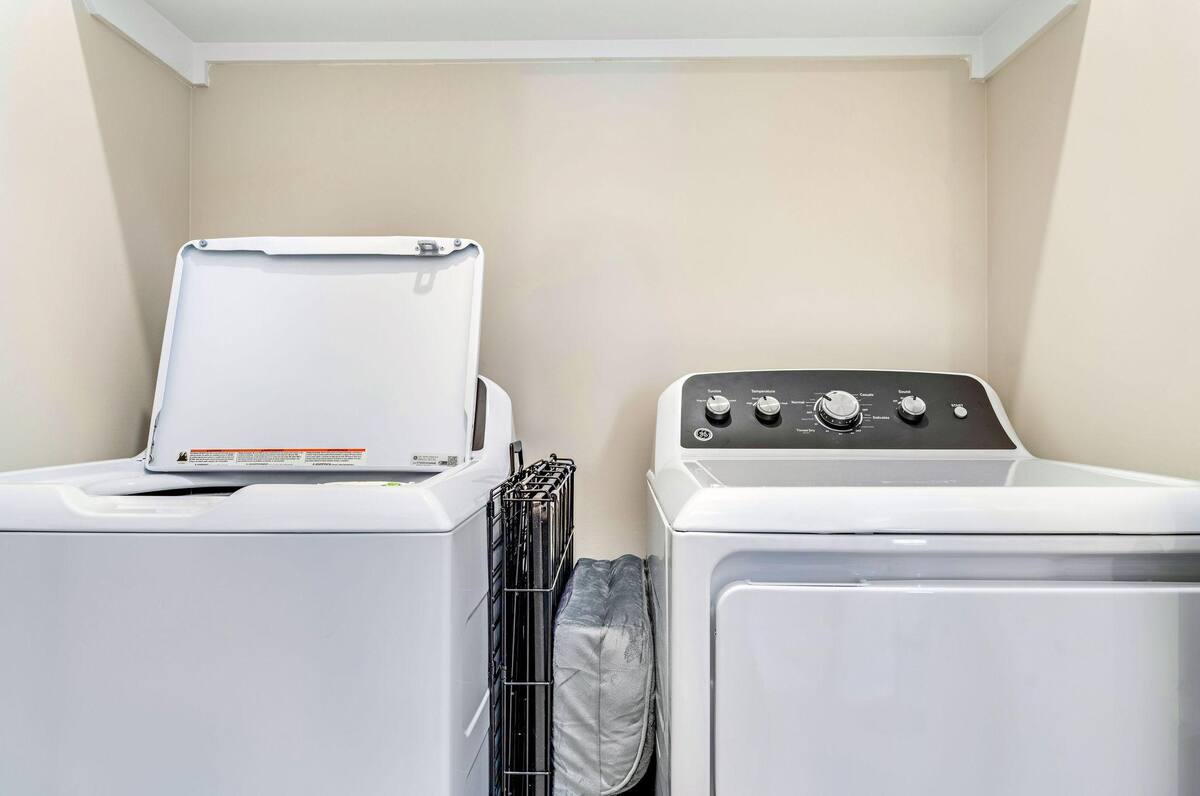 Enjoy the convenience of a private laundry area, making it easy to refresh beachwear and stay comfortable throughout your stay.