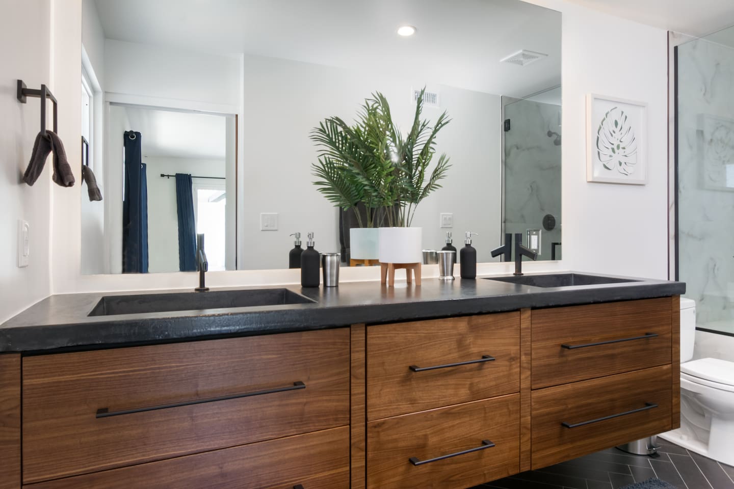 Custom walnut cabinets with concrete cast linear sinks