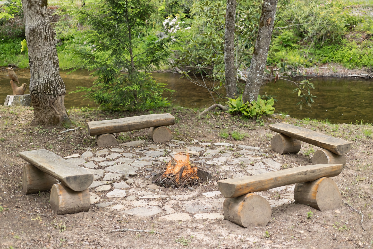With bench seating, creek views, and the relaxing sound of rushing water, the fire pit area is perfect for cozy mountain evenings.