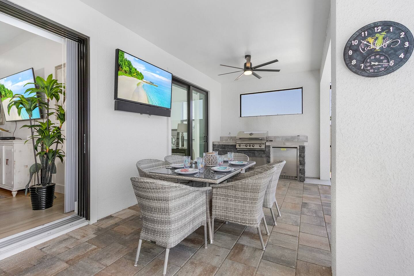 Enjoy outdoor dining while watching your favorite shows on the outdoor TV, all set against spectacular pool and water views!
