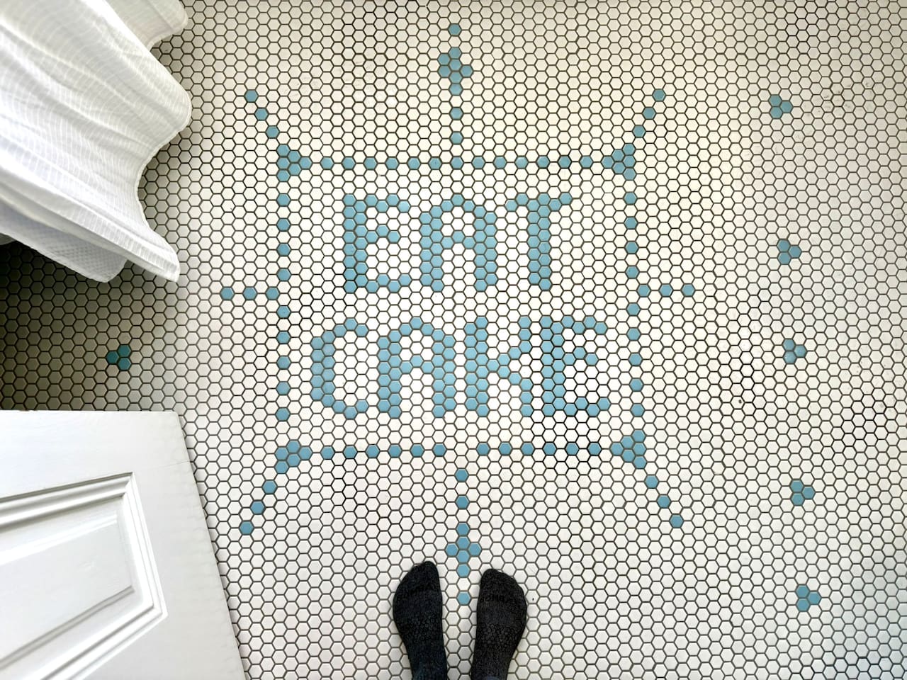 Custom hex-tile floor offers one simple instruction for your stay in Los Alamos: ENJOY!! Character-filled surprises like this are tucked throughout Heritage House.