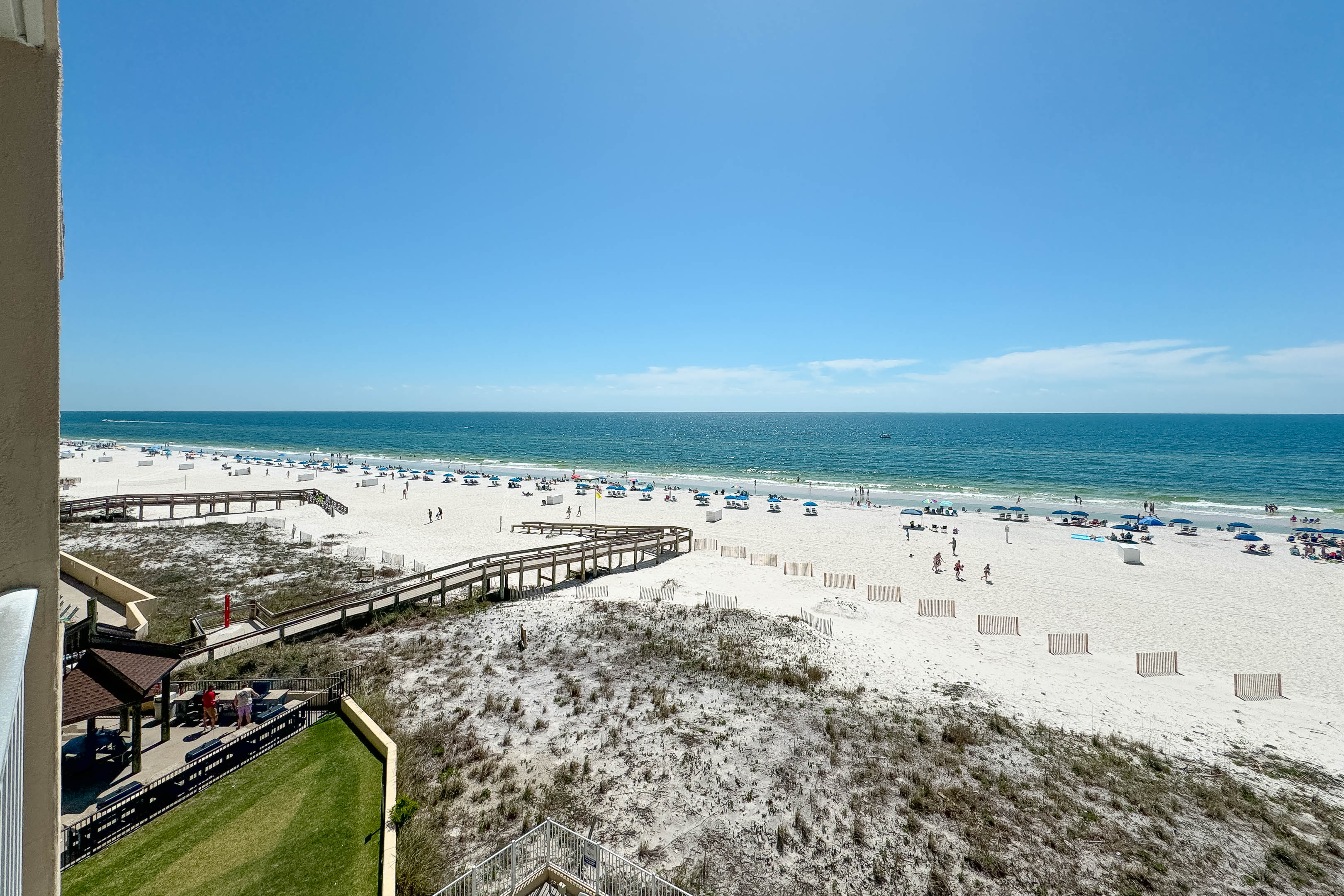 Directly on the sands, this beachfront building offers unparalleled access to the shore and stunning coastal views.