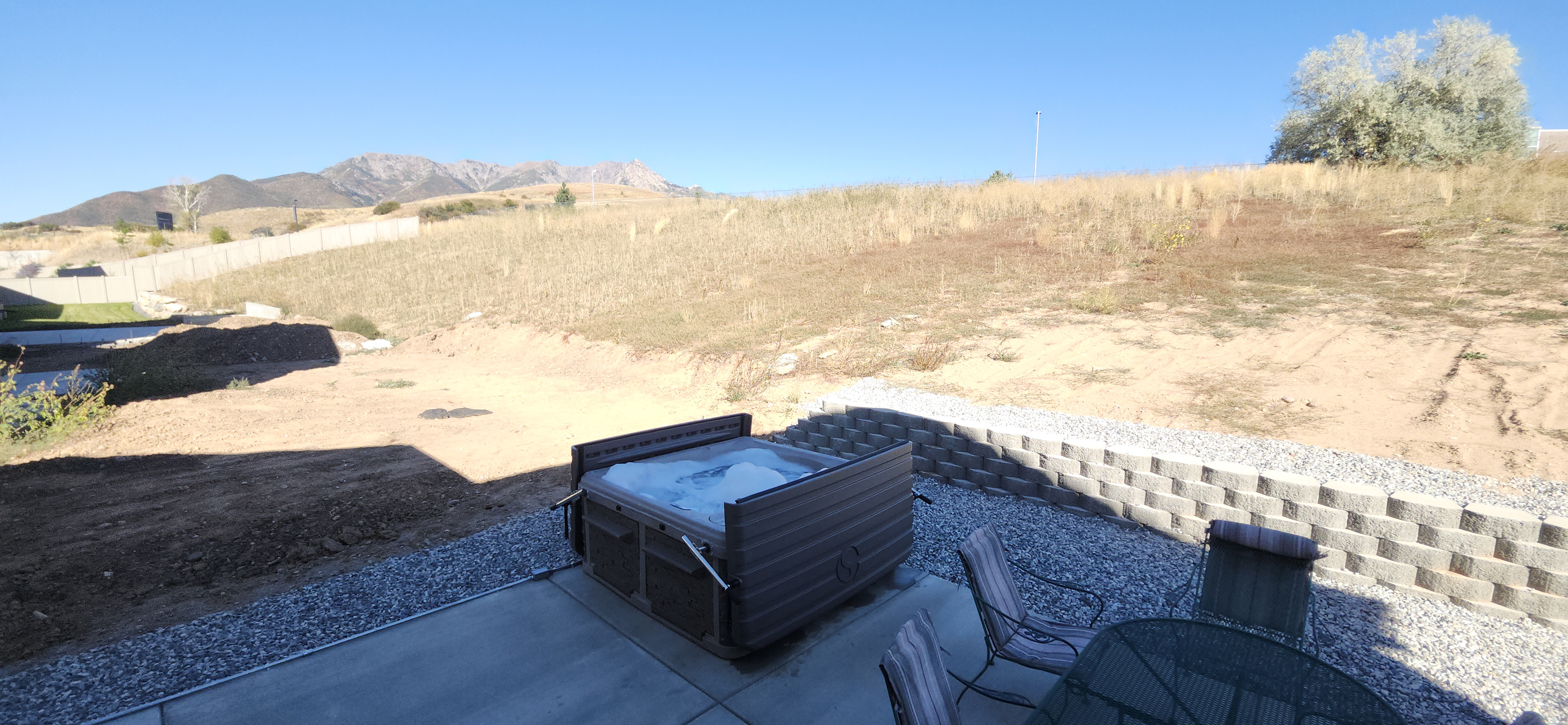 Soak in the private hot tub while taking in the stunning Wasatch Mountain views.