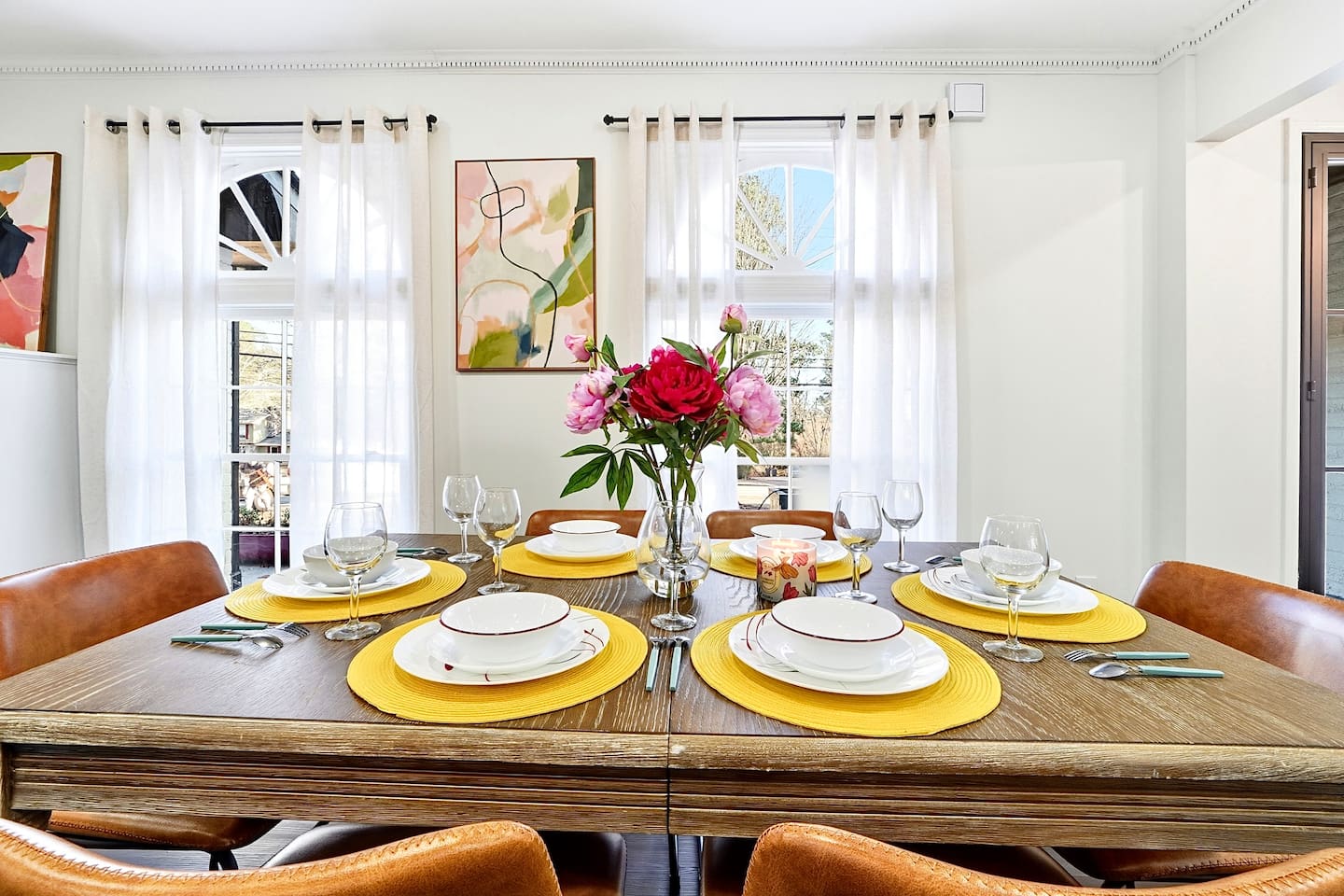Charming wooden dining area comfortably seating up to 6 guests. Perfect for sharing meals, laughs, and creating lasting memories.