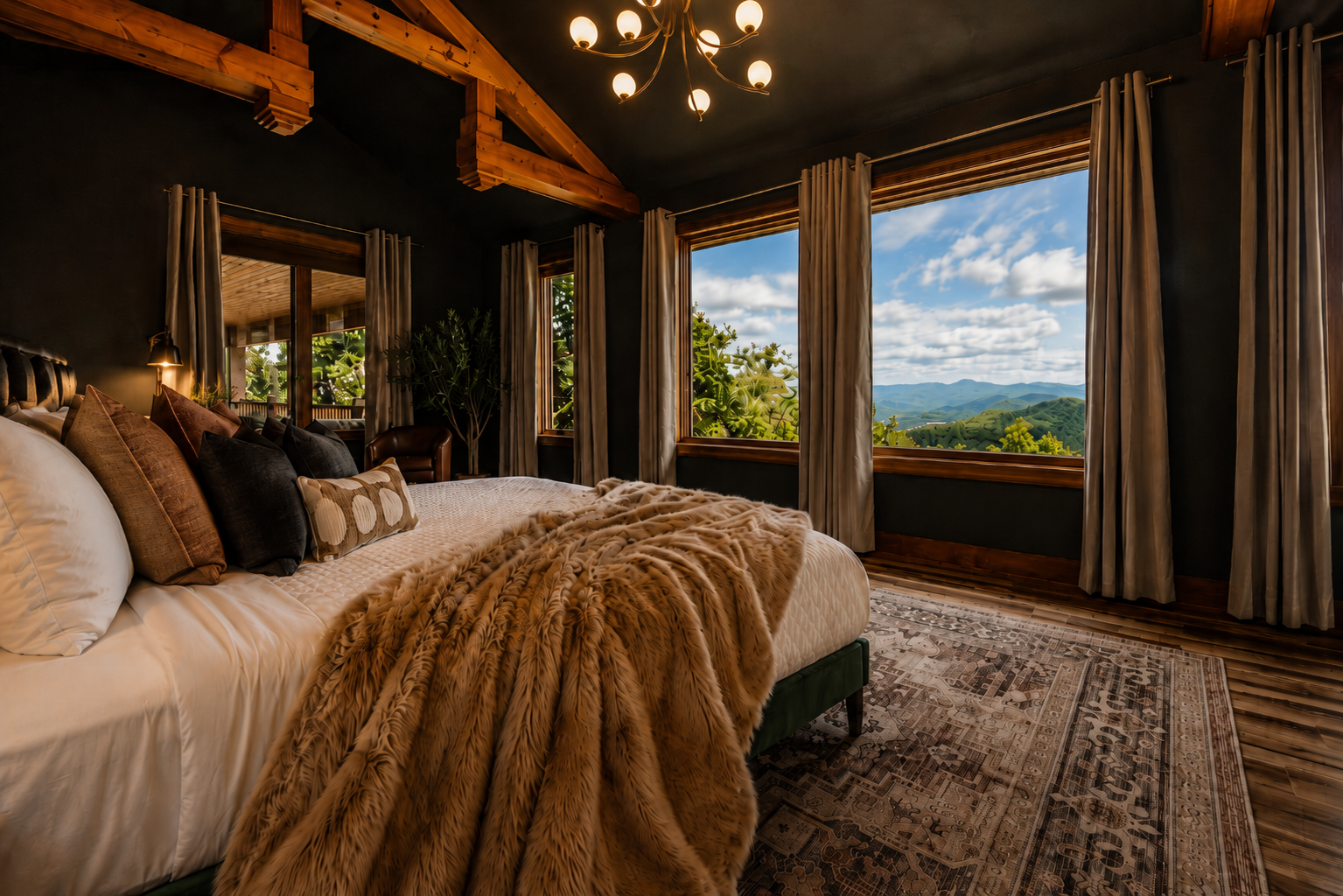 {Master Bedroom} Wake up to sweeping mountain views from this spacious king retreat, complete with soaring wood beams, moody designer finishes, plush bedding, and a cozy faux-fur throw.