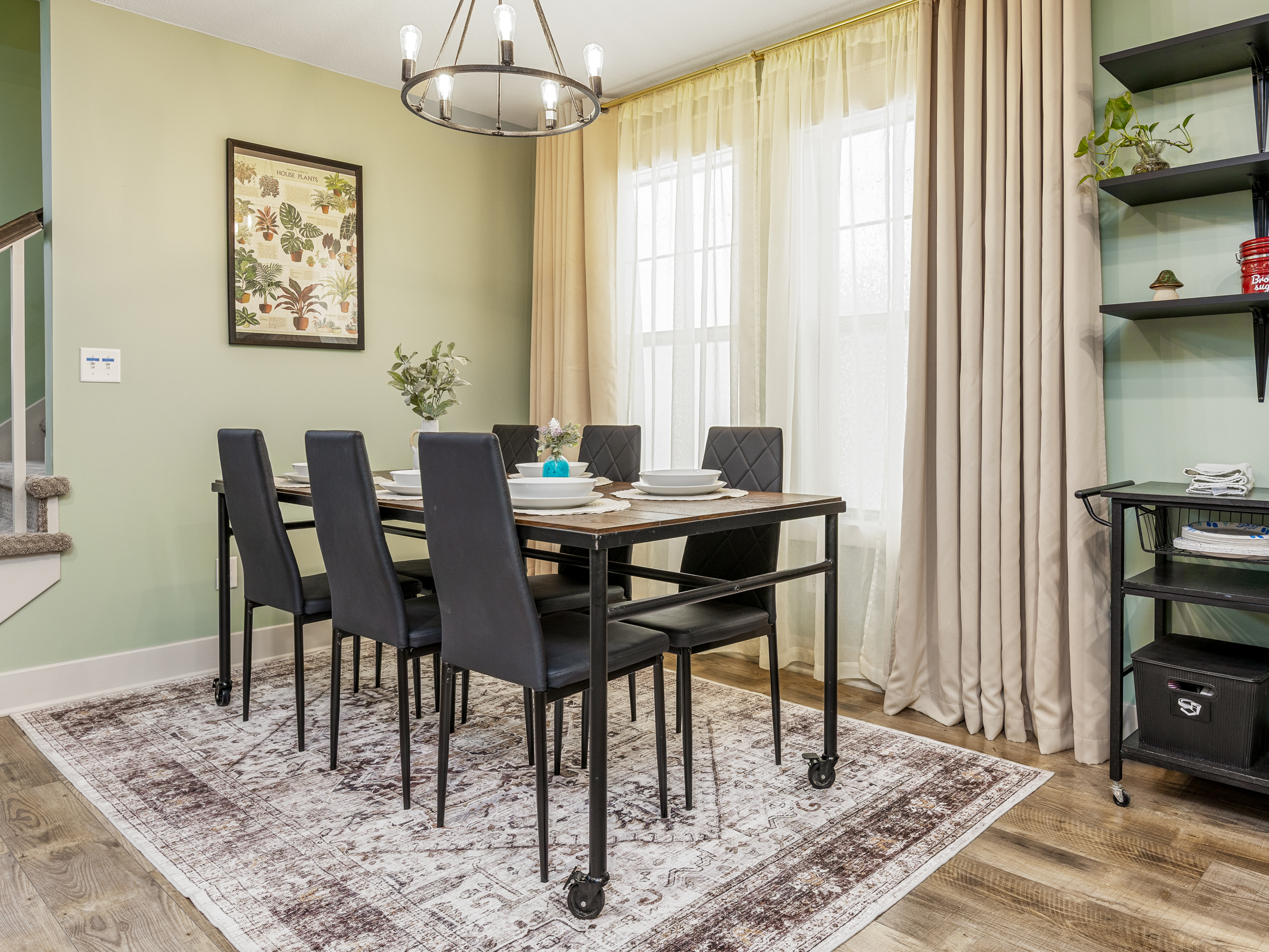 Dining area with seating for six provides plenty of room for group meals and gatherings. The open layout keeps everyone connected to the heart of the home.