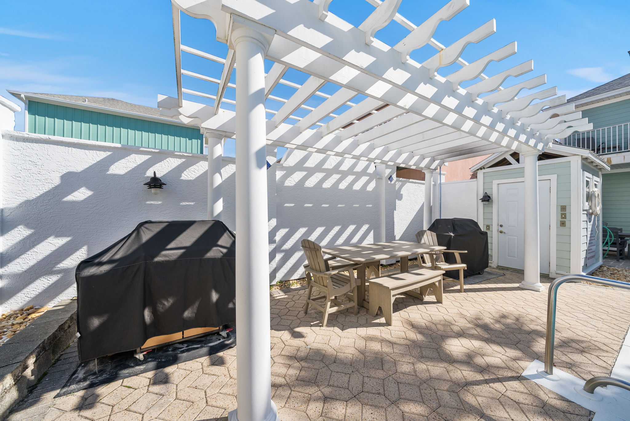 2 Weber grills, a gazebo, nice table, plus other tables and lounge chairs around the pool!