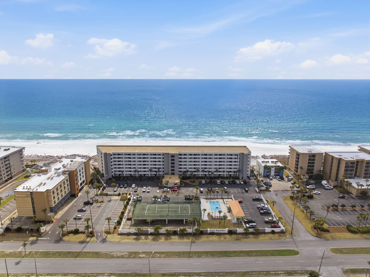 Surf Dweller complex is gulf front and has pool, fitness center and tennis courts