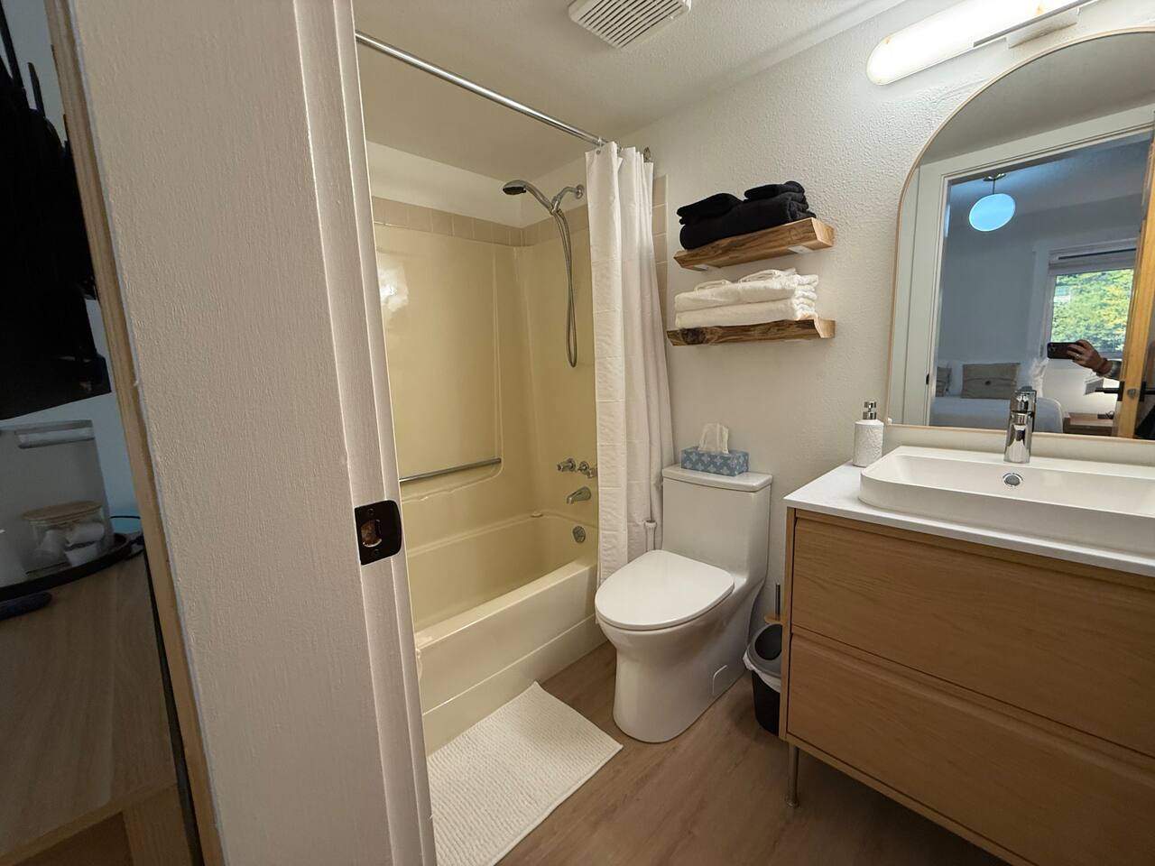 Bathroom Details: Includes a new comfort-height toilet and a clean shower/tub combination, with thoughtful storage solutions provided.