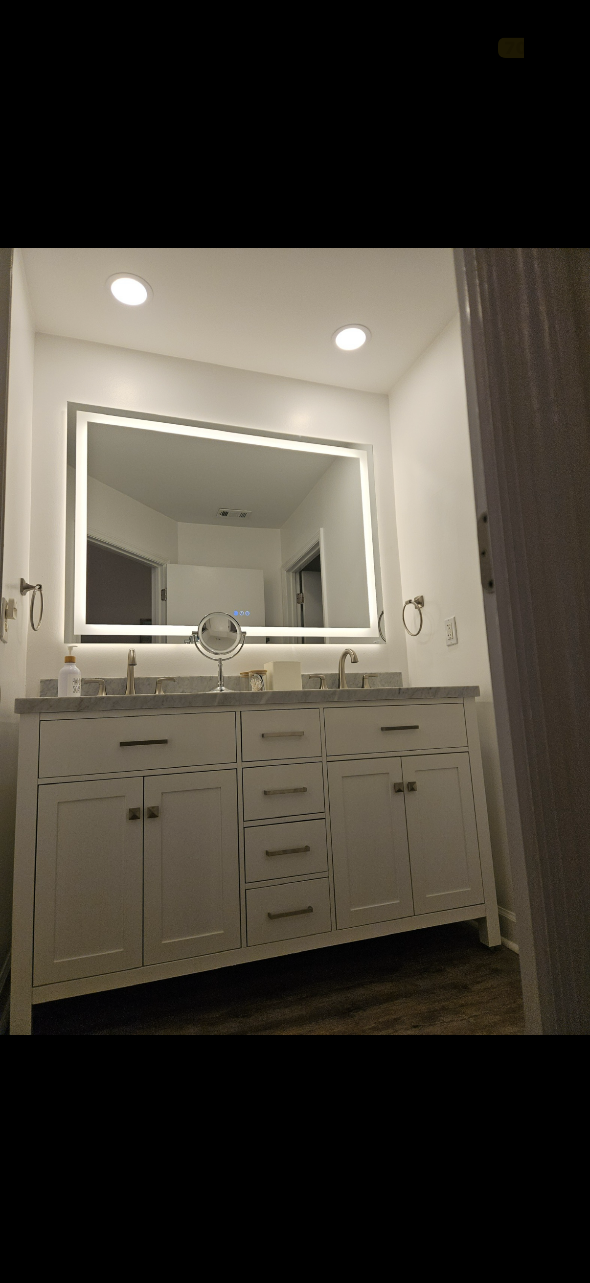 New master bathroom marble vanity w/ LED mirror and recessed lights.