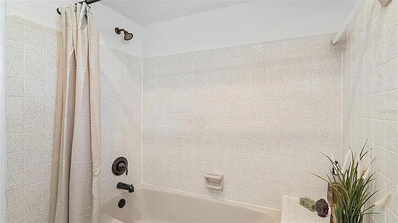 The main bathroom offers a shower and tub combo.