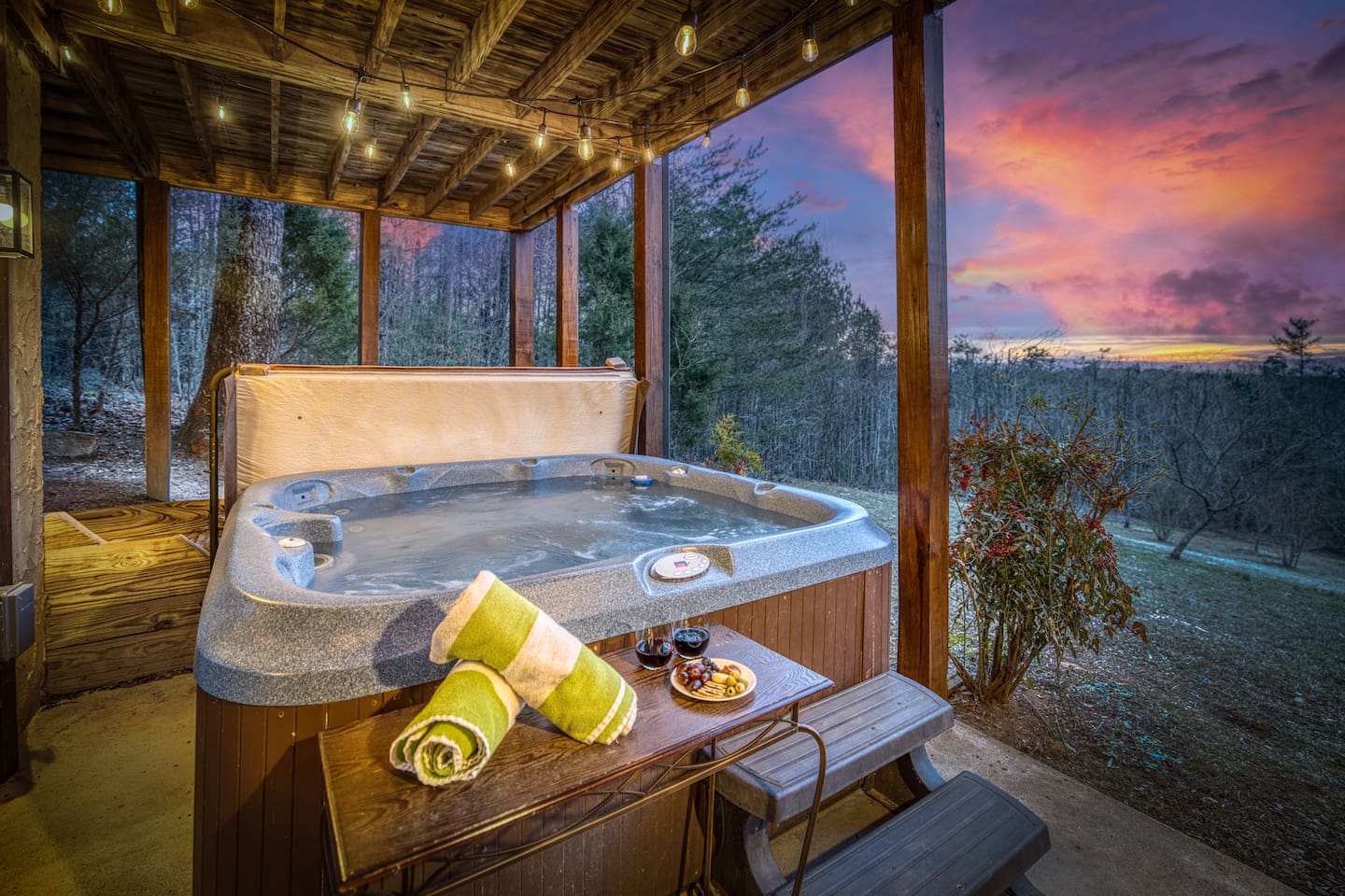Hot tub looking out over back yard with orchard trees (seasonal fruit), firepit, woods with hiking paths, and mountain views!