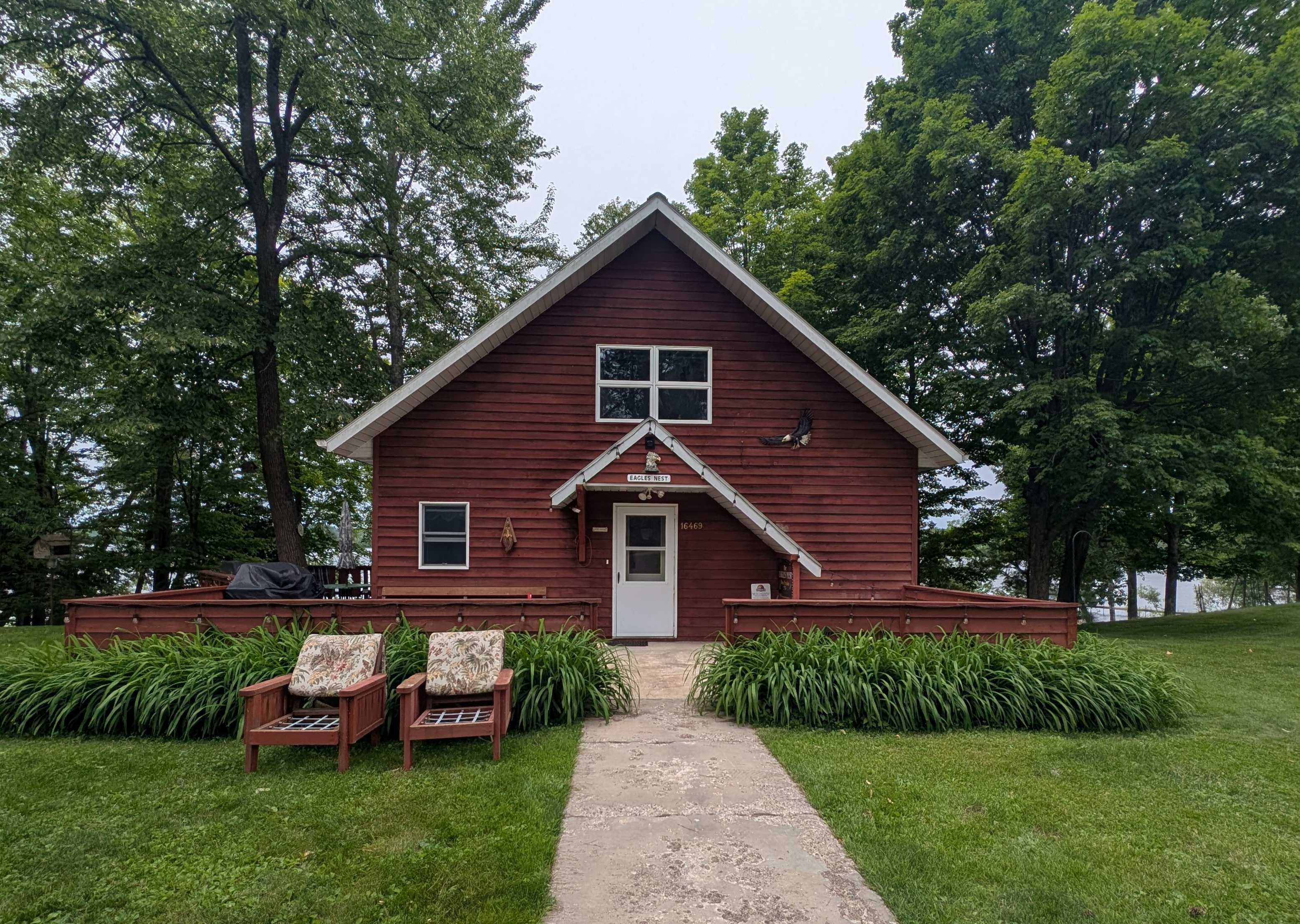 Eagle's Nest #4 Welcome to Eagle's Nest, a cozy A-Frame home with west-facing views that look over Butternut Lake. This beautiful cabin features wall-to-wall picture windows that fill every room with natural light and sweeping lake vistas.