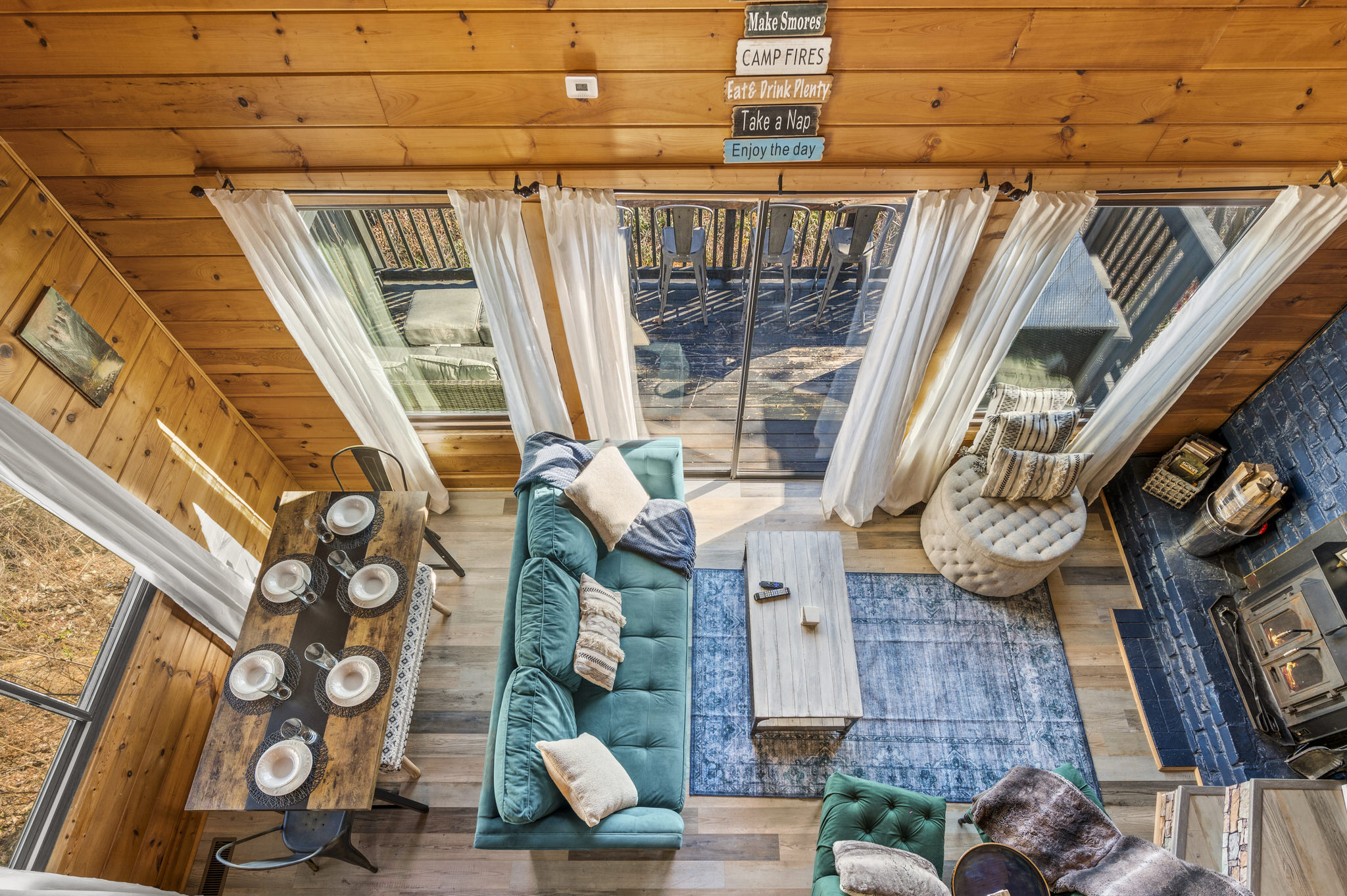 Birds eye view from king loft bedroom lookout on all the main living room floor action.