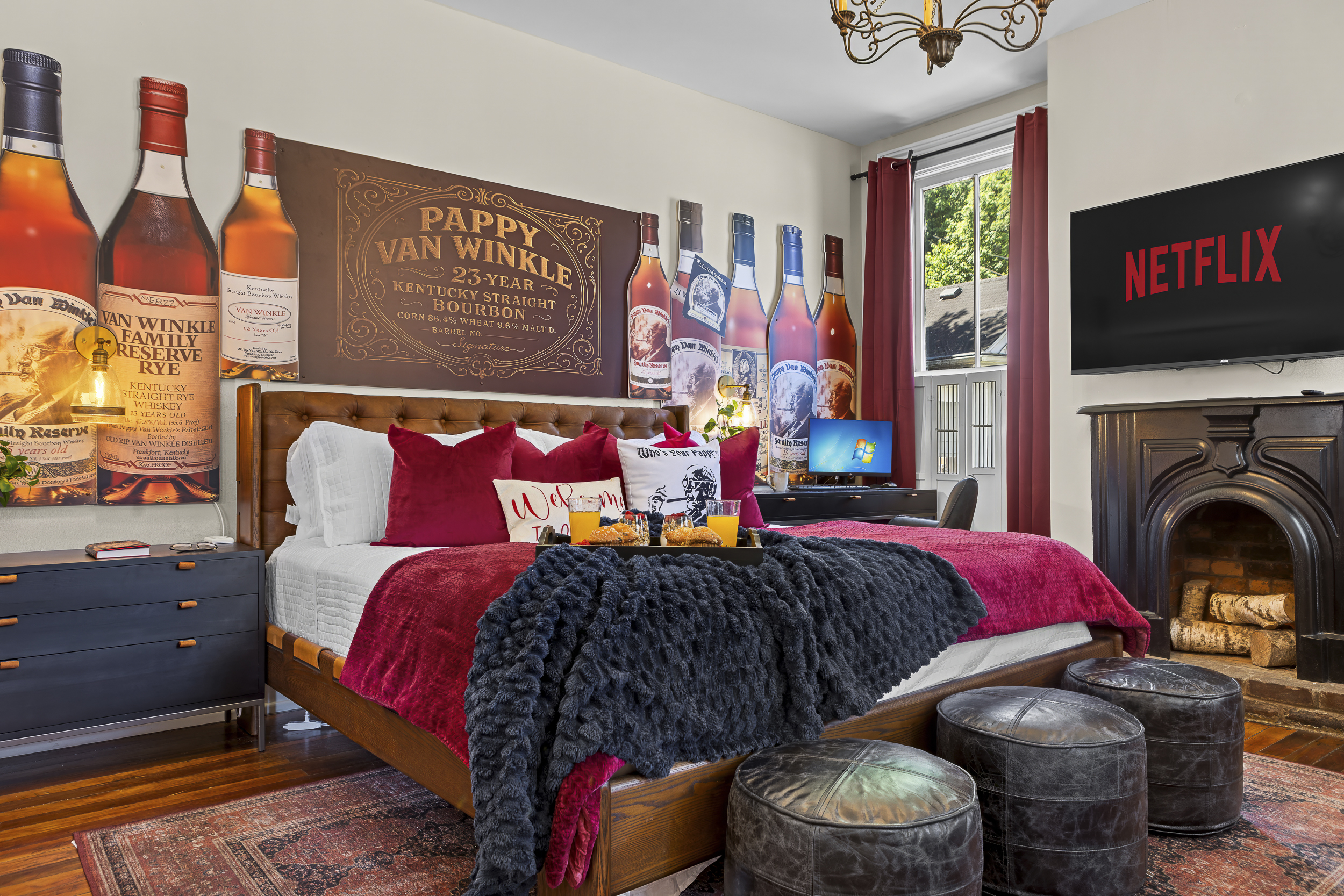 Check into the Pappy Van Winkle Room, featuring a king bed draped in burgundy and décor inspired by bourbon's most coveted name.