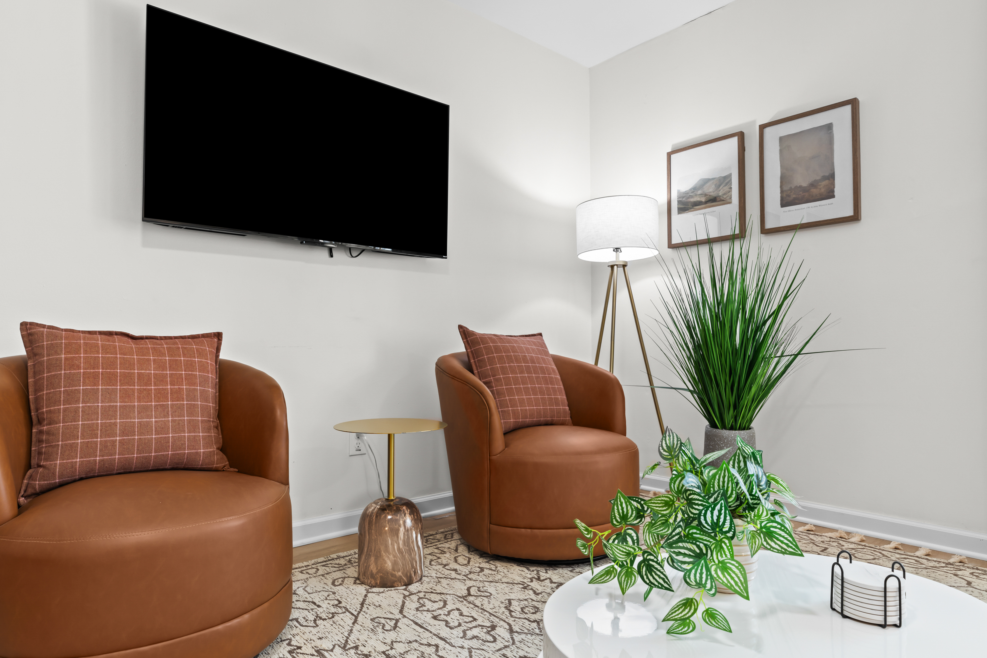 Two comfortable armchairs in a quiet corner for relaxing.