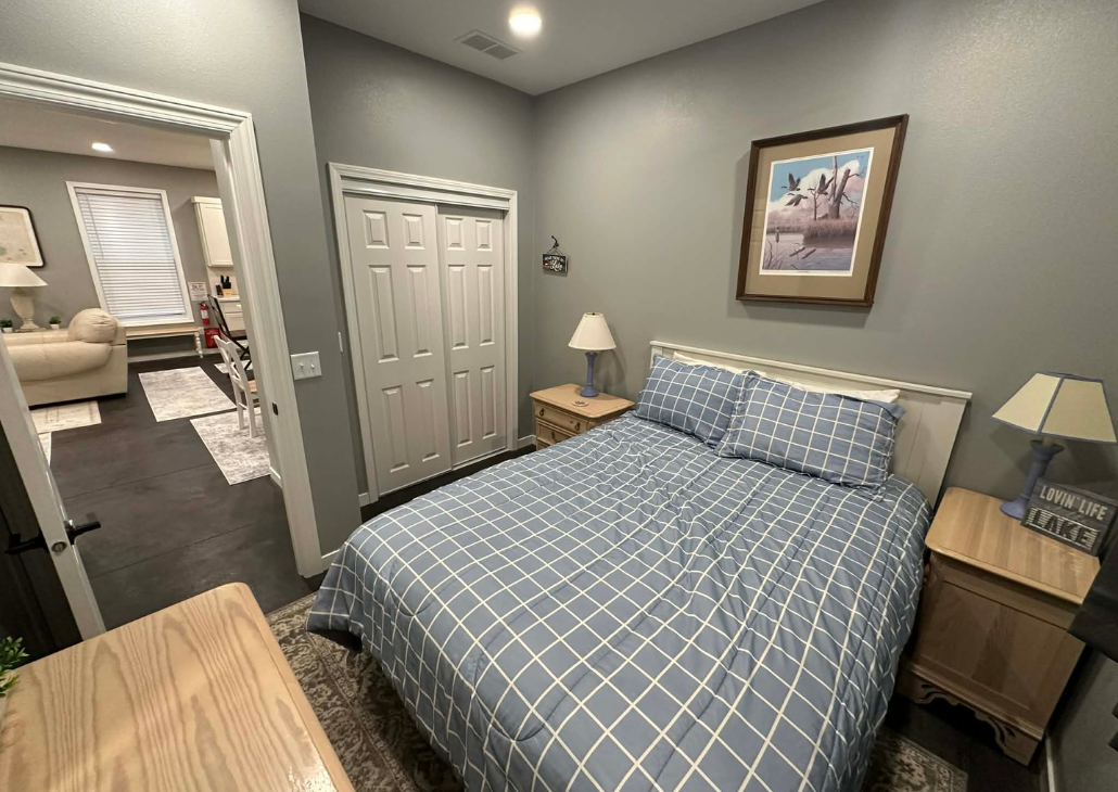 NEW HOUSE: Bedroom 2 with queen bed and a dresser.