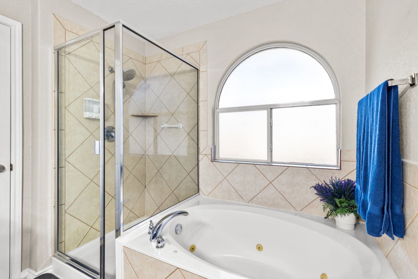 Spacious master ensuite featuring a double vanity, standalone shower, and soothing jacuzzi spa bathtub—perfect for unwinding after a day in San Antonio.