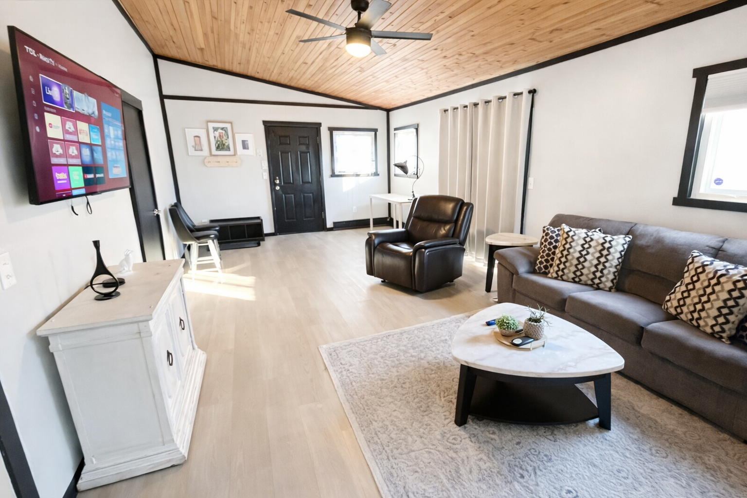 Spacious Living area features 55in Smart TV and plenty of seating for everyone