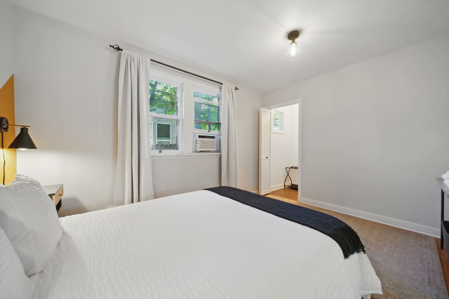Queen bedroom #2, with window AC unit & walk in closet. 