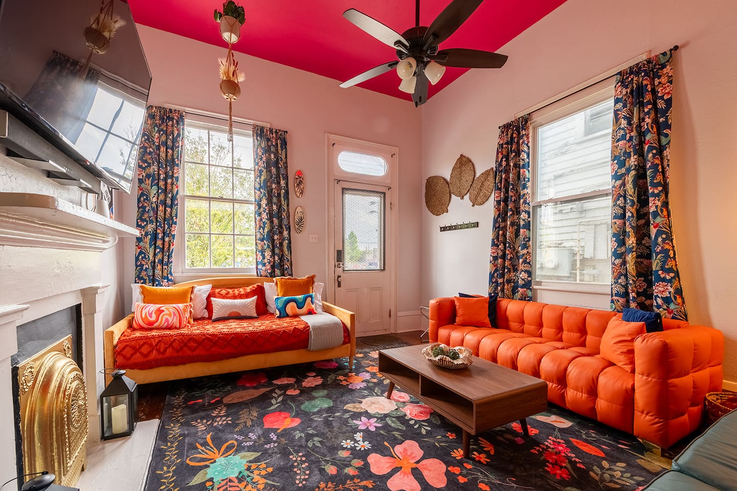 The colorful, eclectic living room reflects the vibrant nightlife of St. Claude Avenue, just outside your front door.