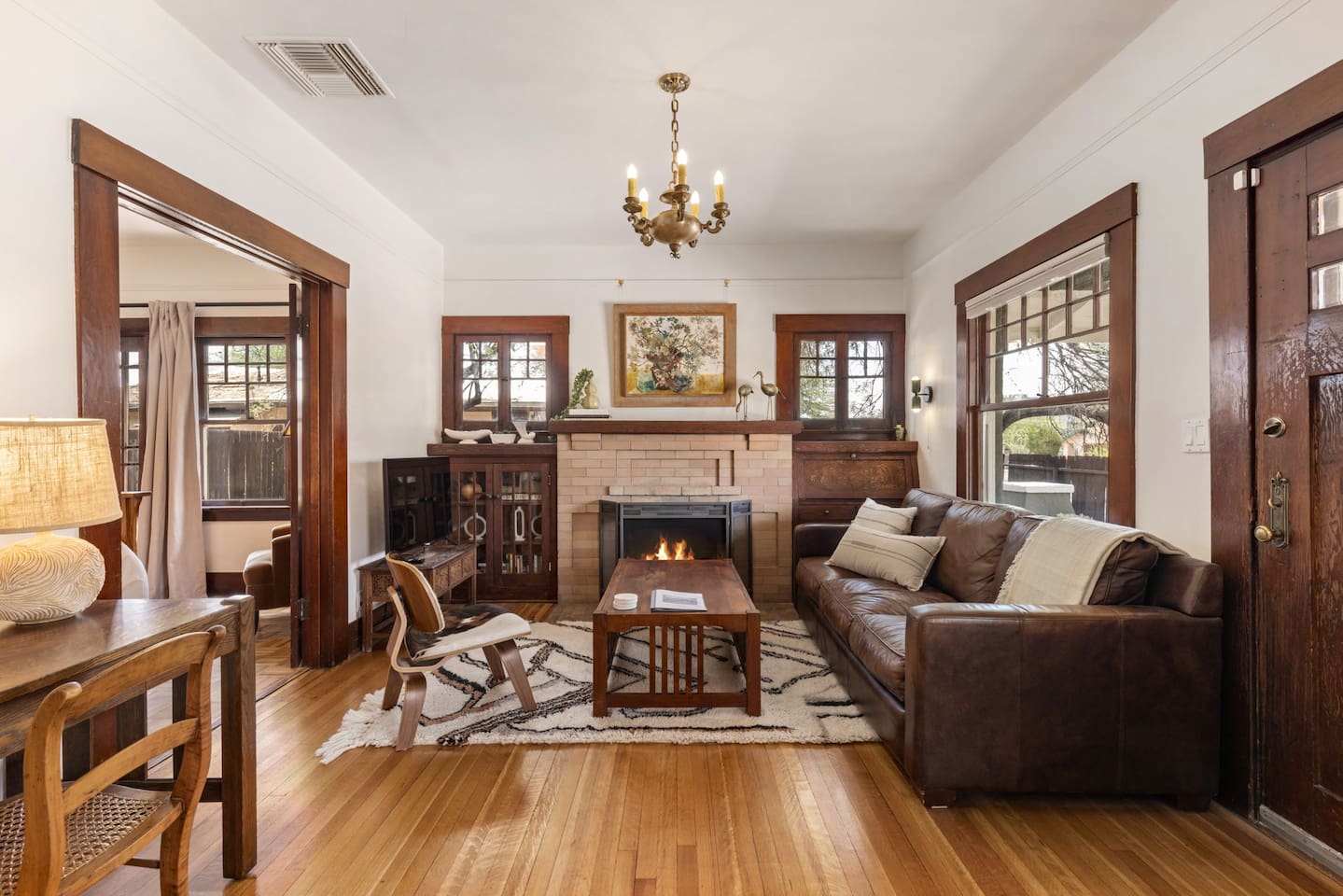 tastefully furnished living room with TV and decorative fireplace