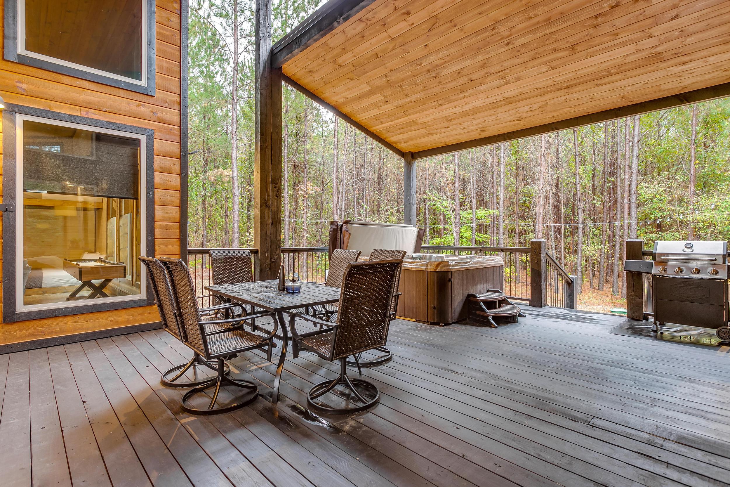 Al fresco dining, grill with propane, and hot tub all under  extra large covered porch