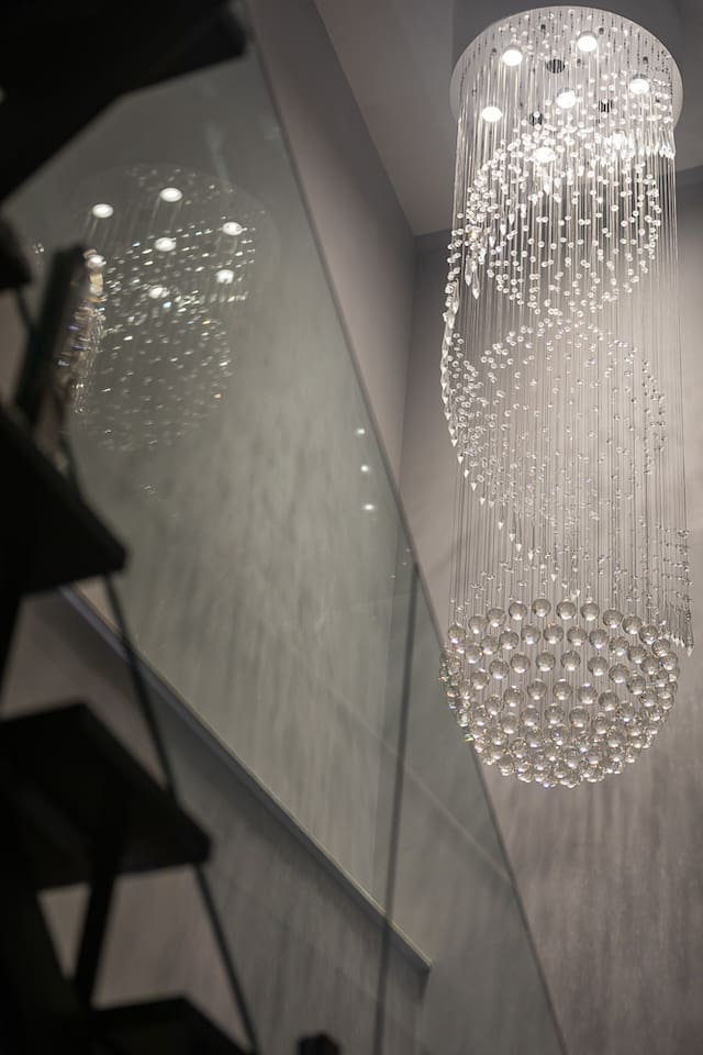 Stunning crystal chandelier.  High end lighting throughout the penthouse. 