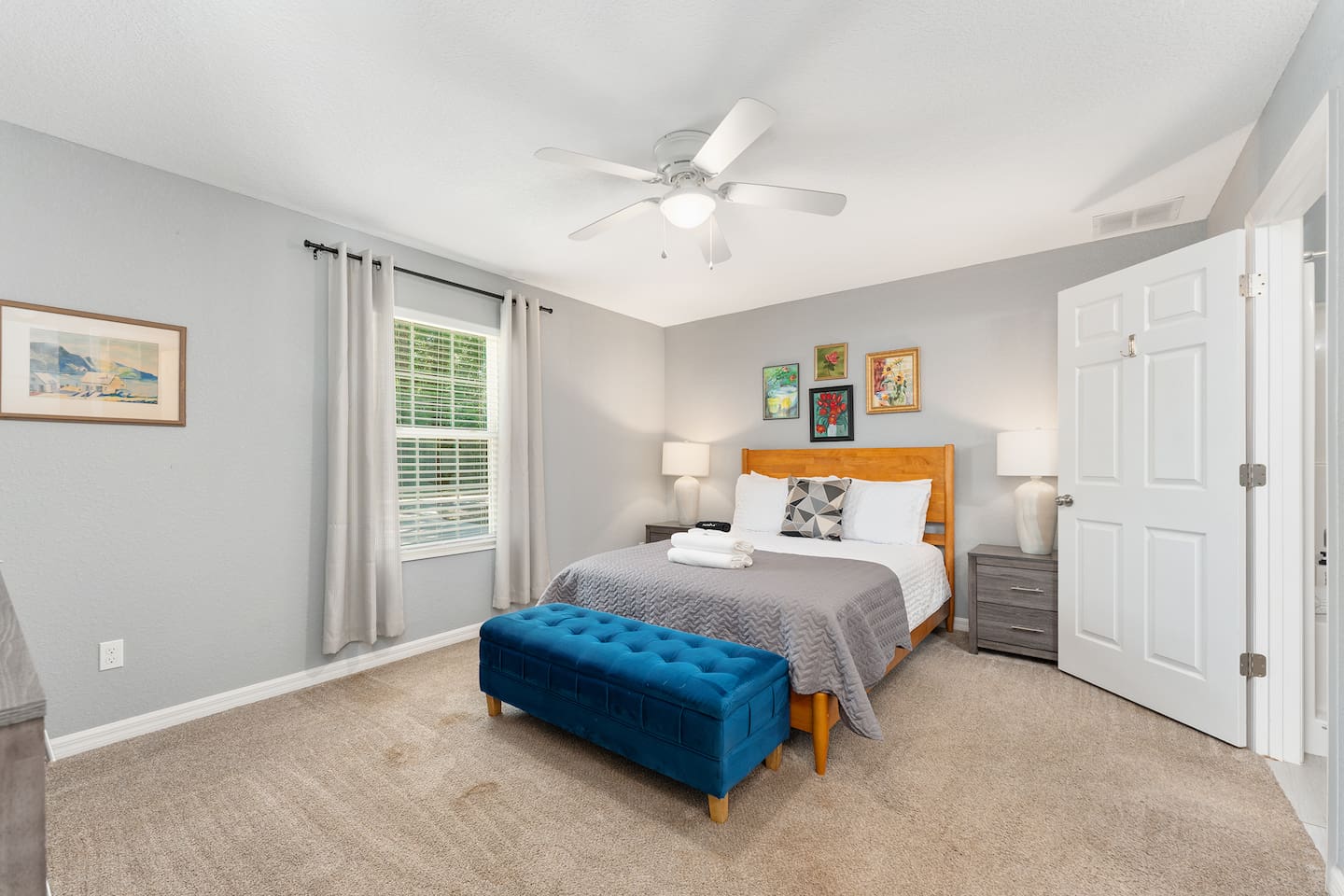 Spacious bedroom with a queen bed.  This bedroom has an ensuite bathroom, walk-in closet and a dresser.