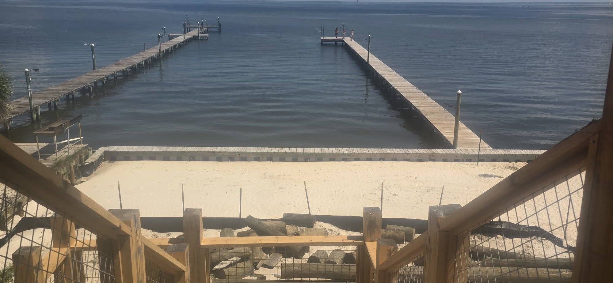 Your own private beach area with shared pier access