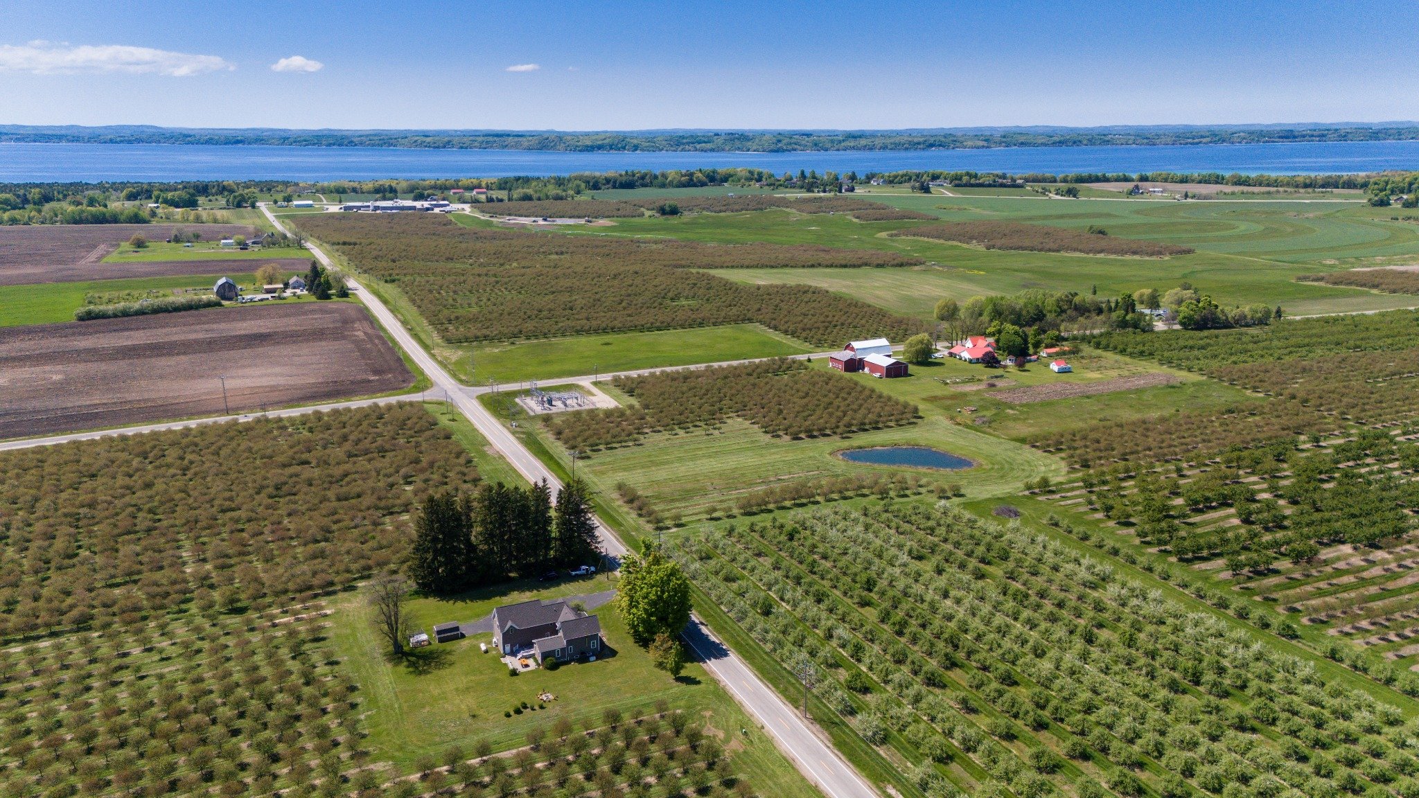 Surrounded by orchards with distant lake views.