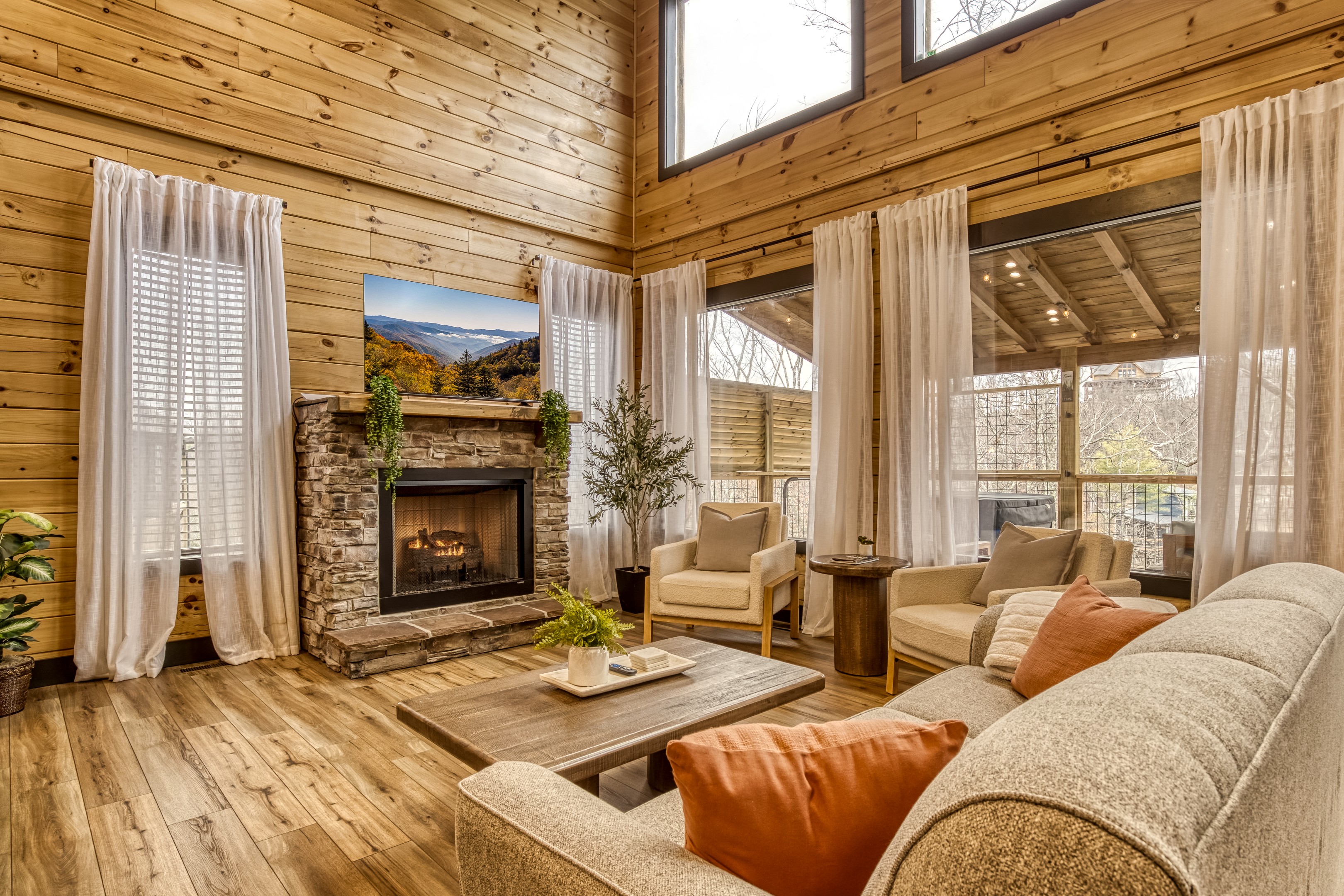 Gather in the bright, open living room where modern touches meet mountain comfort