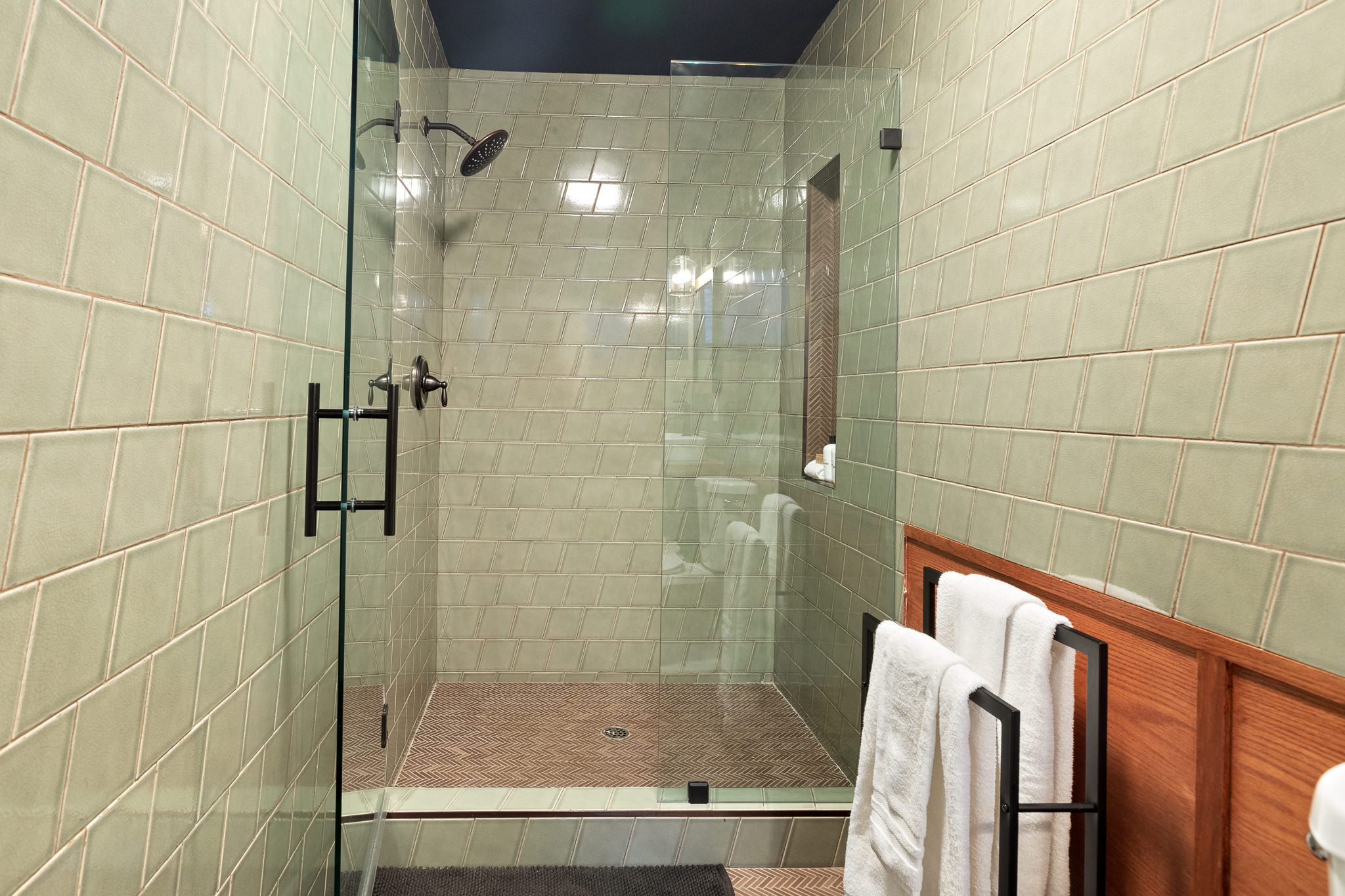 Modern ensuite bathroom on lower level master bedroom with a walk in shower.