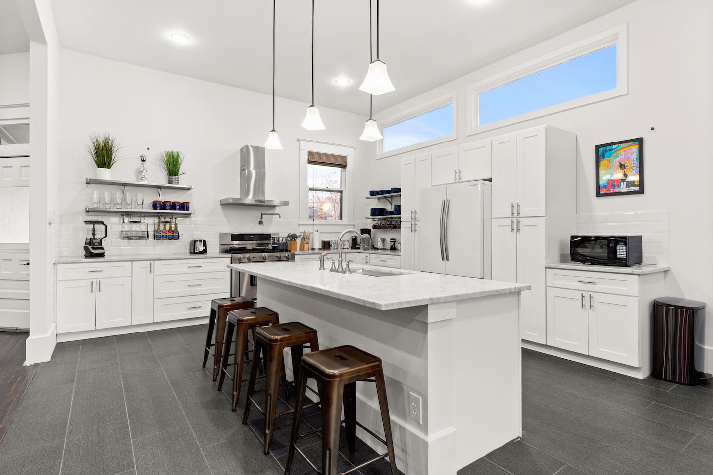 Crafted for culinary delights, our sleek, fully equipped kitchen is the heart of the home, perfect for creating and sharing meals.