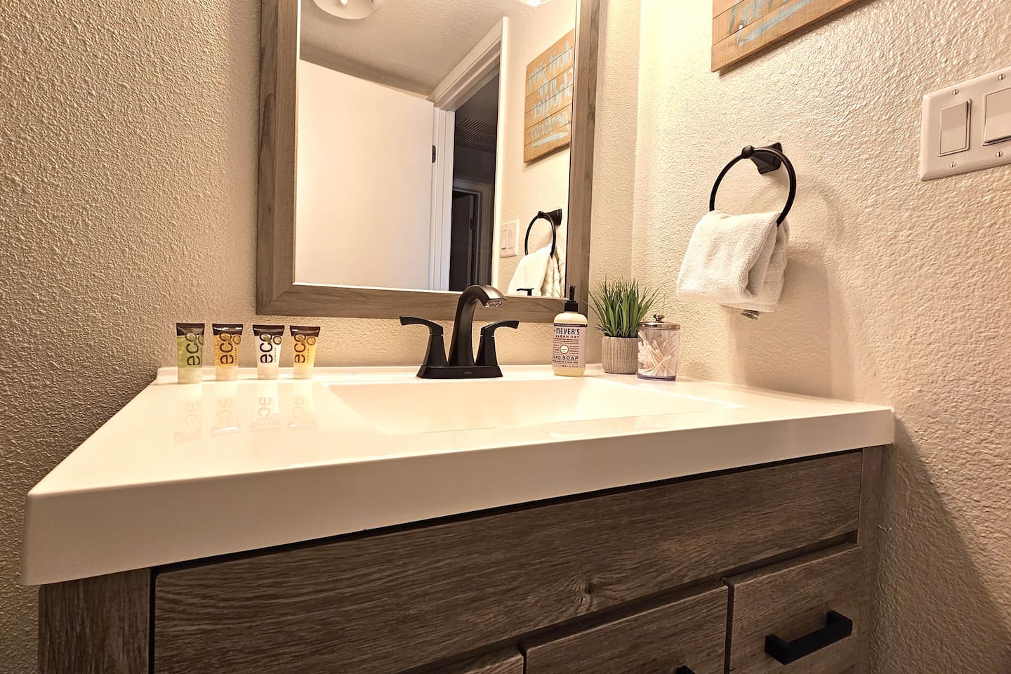 Resort like amenities including shampoo, conditioner, soap, body wash, body lotion, Q-Tips, hair dryer, and makeup remover cloths.