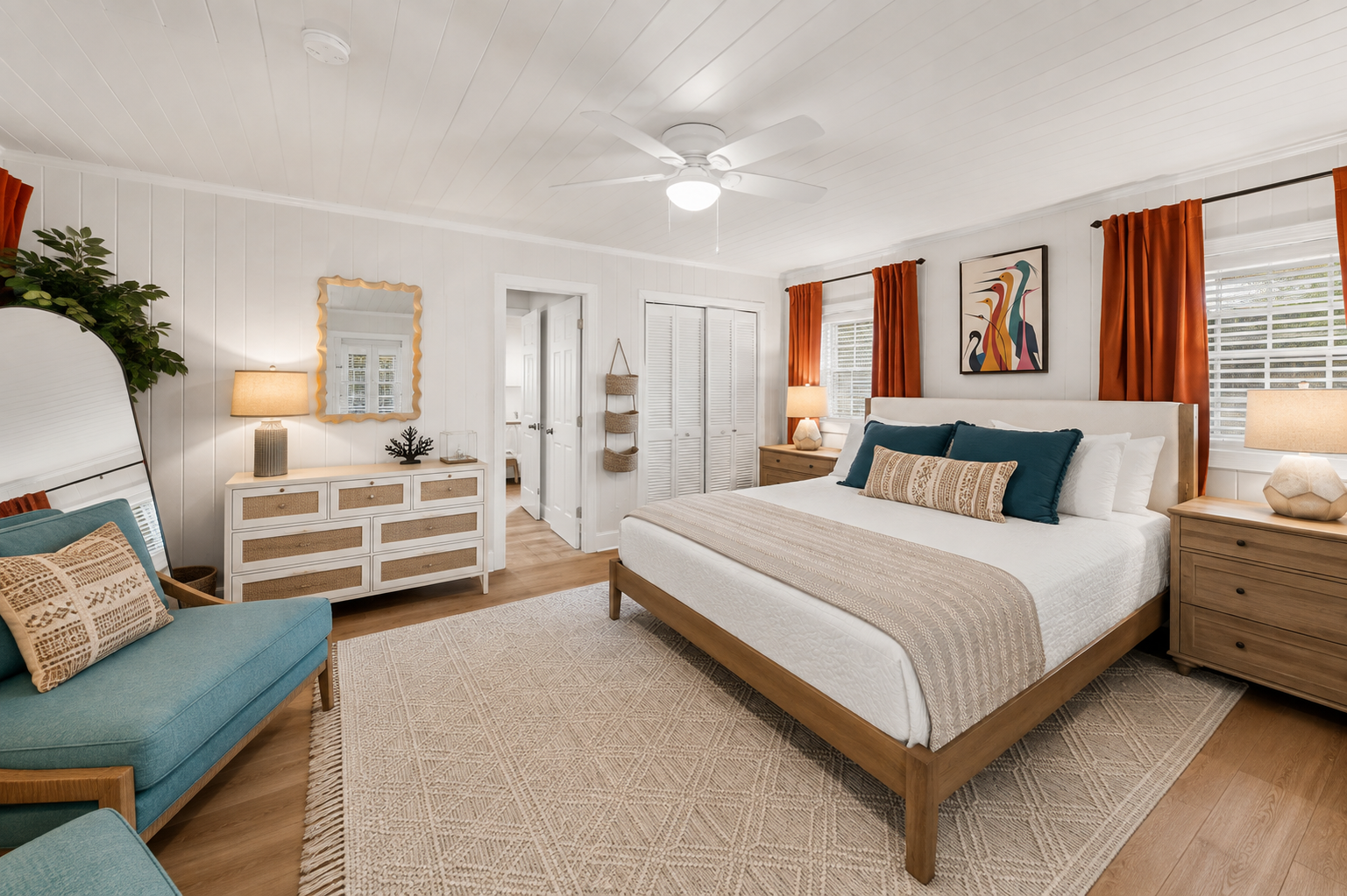 The primary bedroom gives the group leader their own retreat. A king bed, private dressers, armchairs, and arched mirror create a calm
space to come back to after the beach. Have a little one? The pack and plan and extra crib are in the closet!