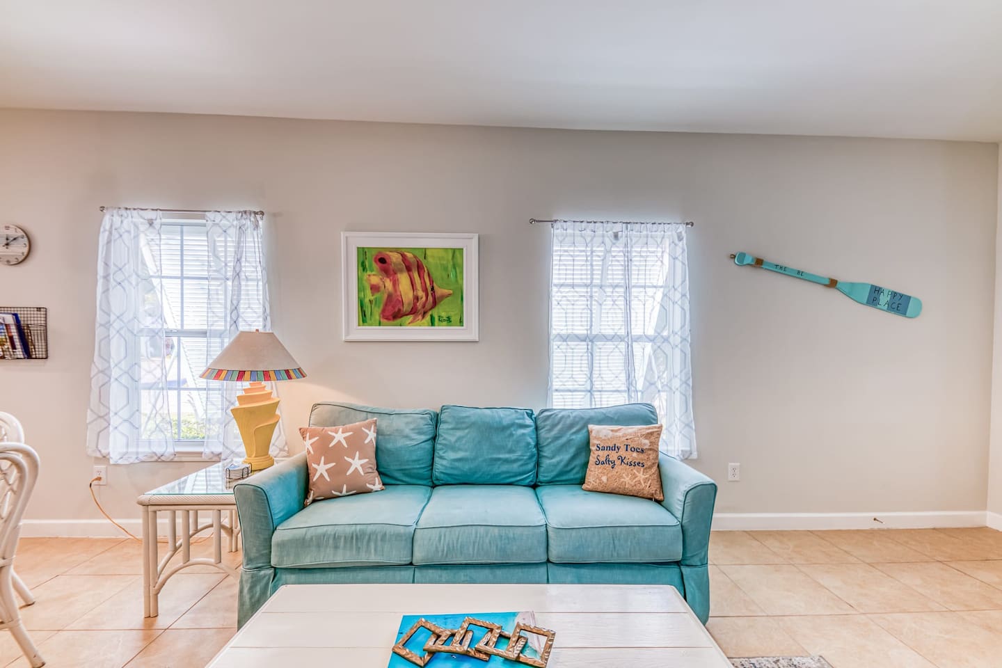 Living Room: Bright and inviting, featuring colorful decor and a view-filled ambiance for relaxation!