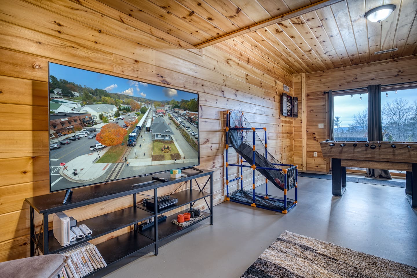 Movie room right off the game room includes big screen smart TV with streaming available, DVD player, and Wii video games!