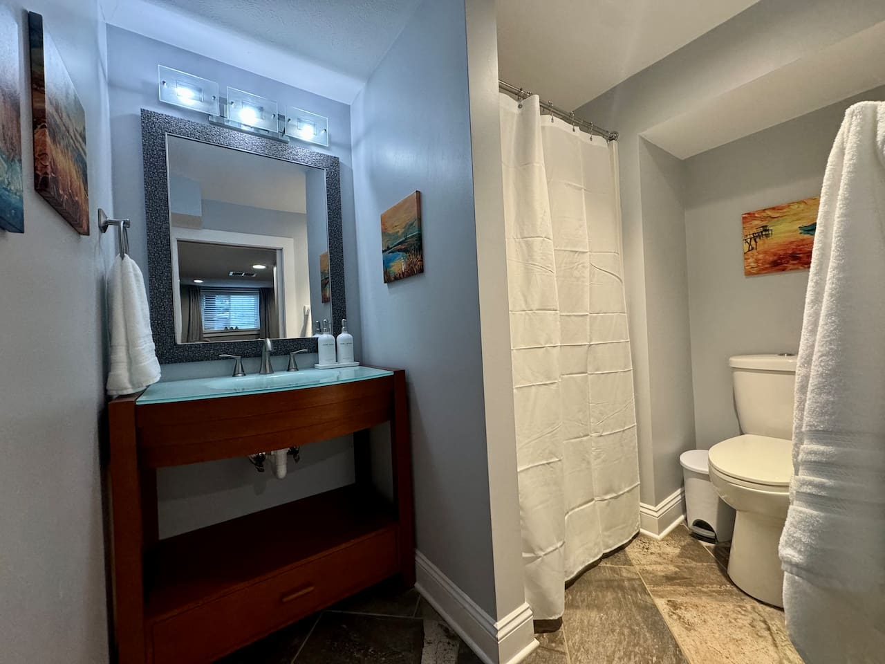 This Garden Level Bathroom has a walk-in shower, vanity and toilet.