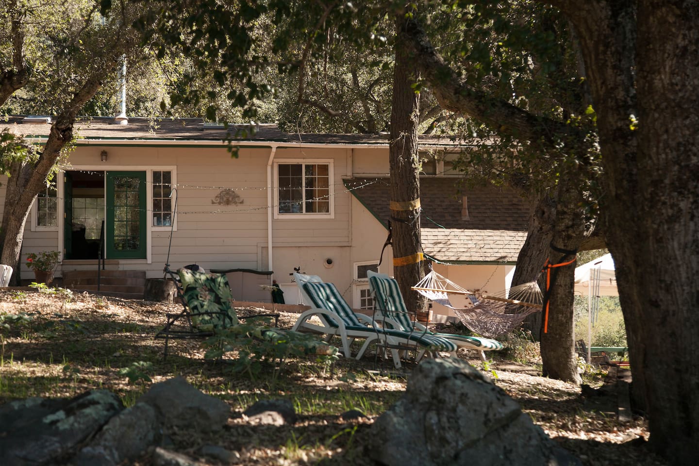 Main house porch with comfy lounge chairs